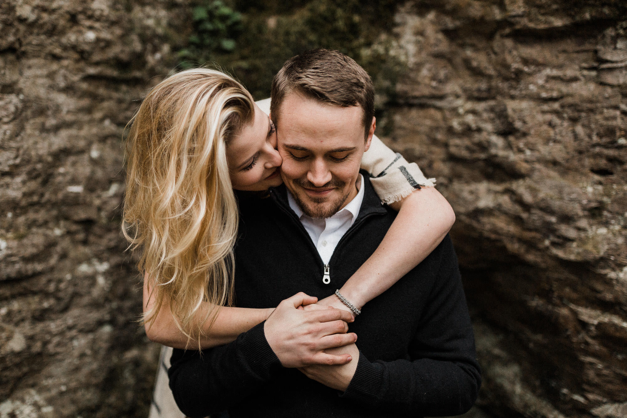 Couple embrace at Latourell Falls in Oregon
