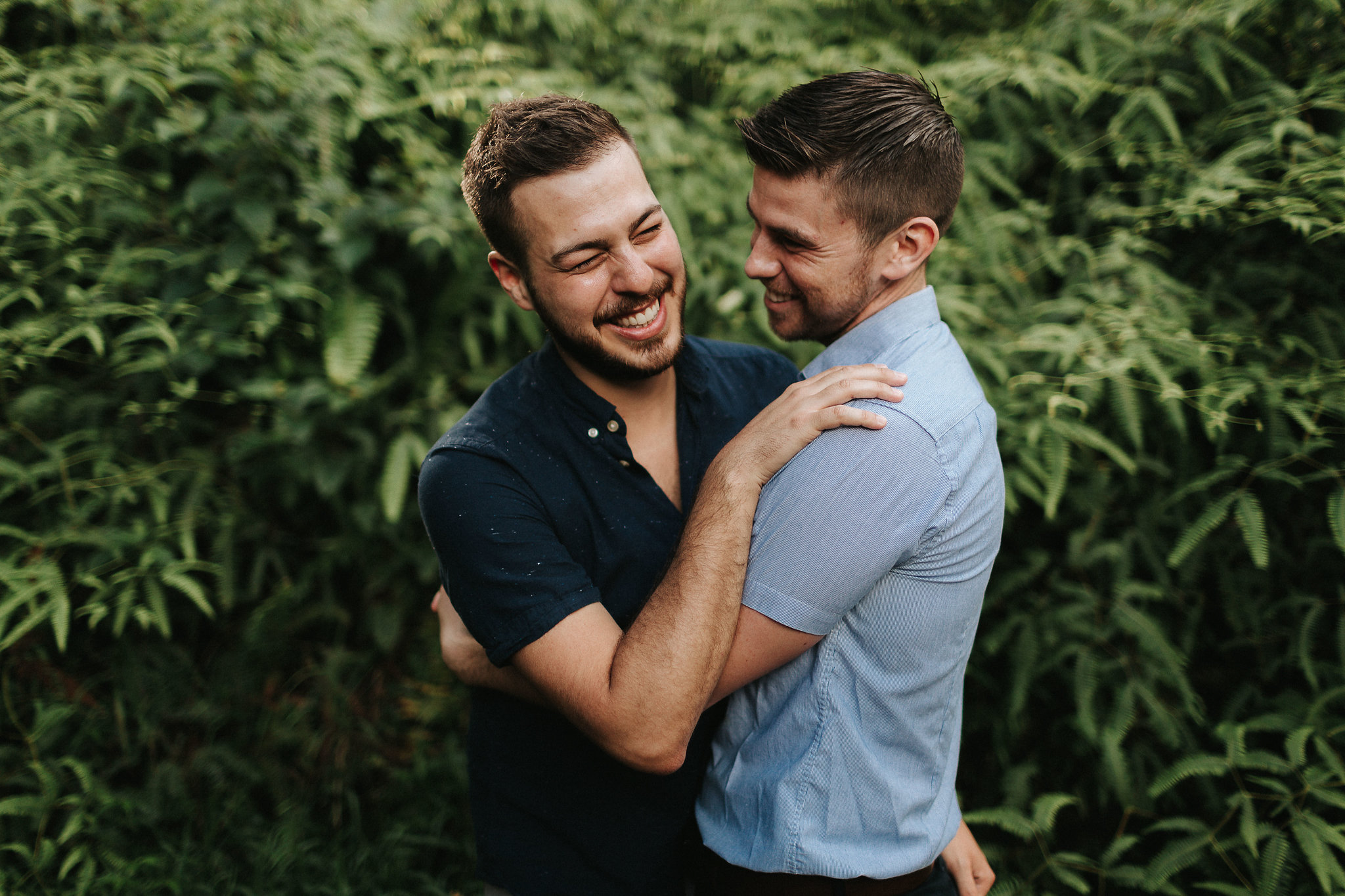 Couple laugh and embrace on Kauai, Hawaii