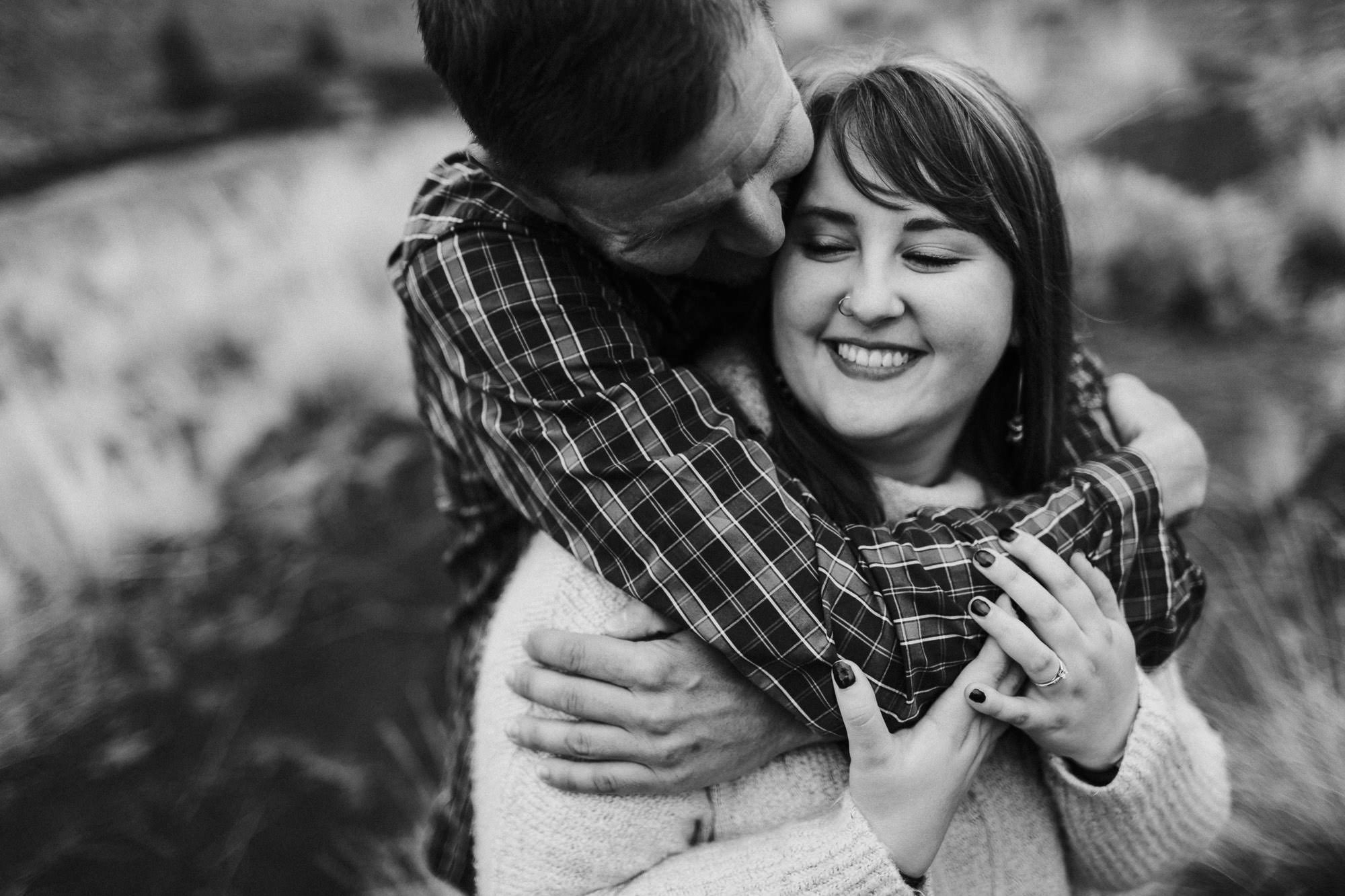 Couple embrace at Smith Rock State Park in Terrebonne, Oregon