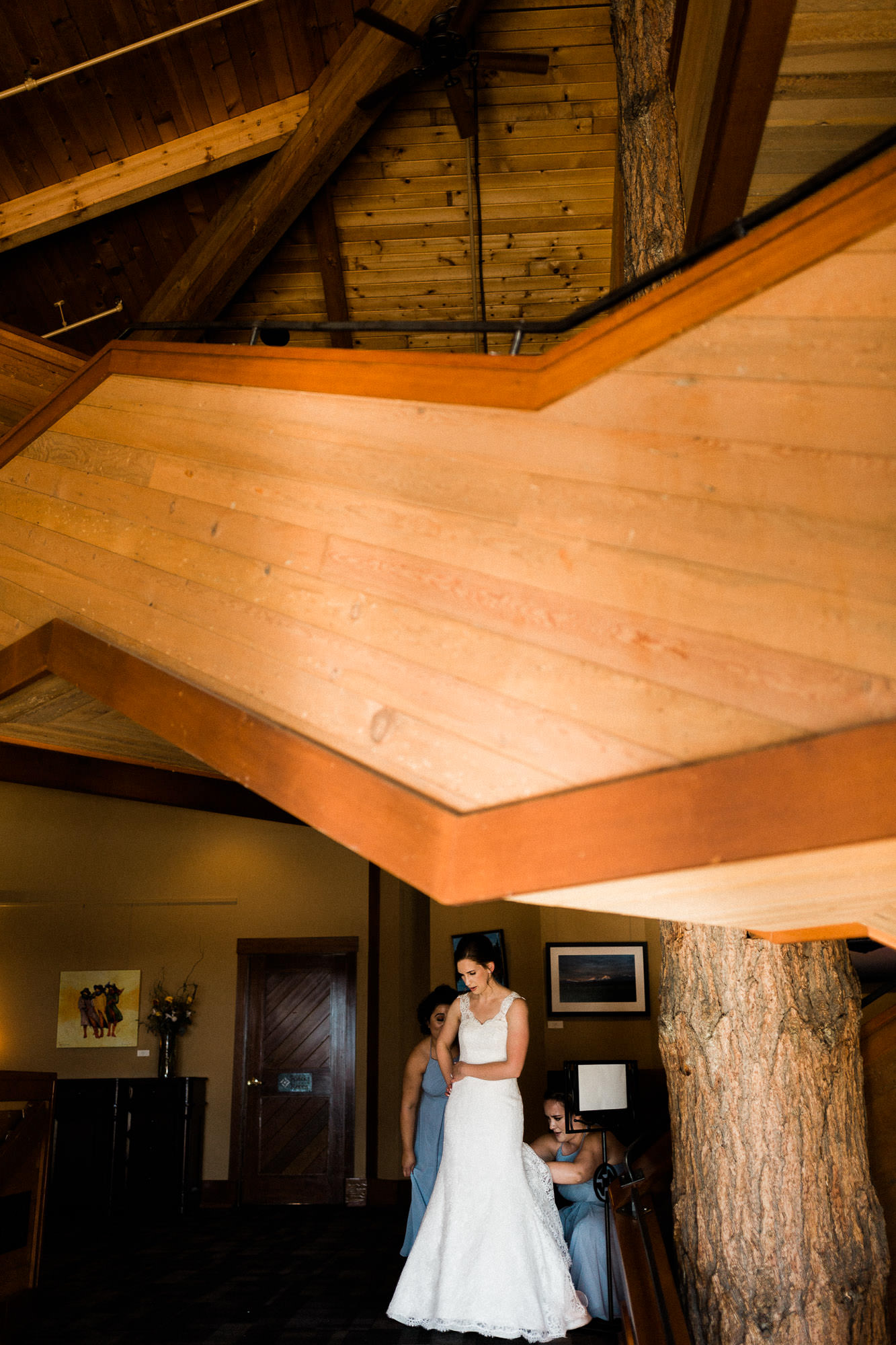 Bridesmaids bustle bride's dress at Black Butte Ranch in Oregon