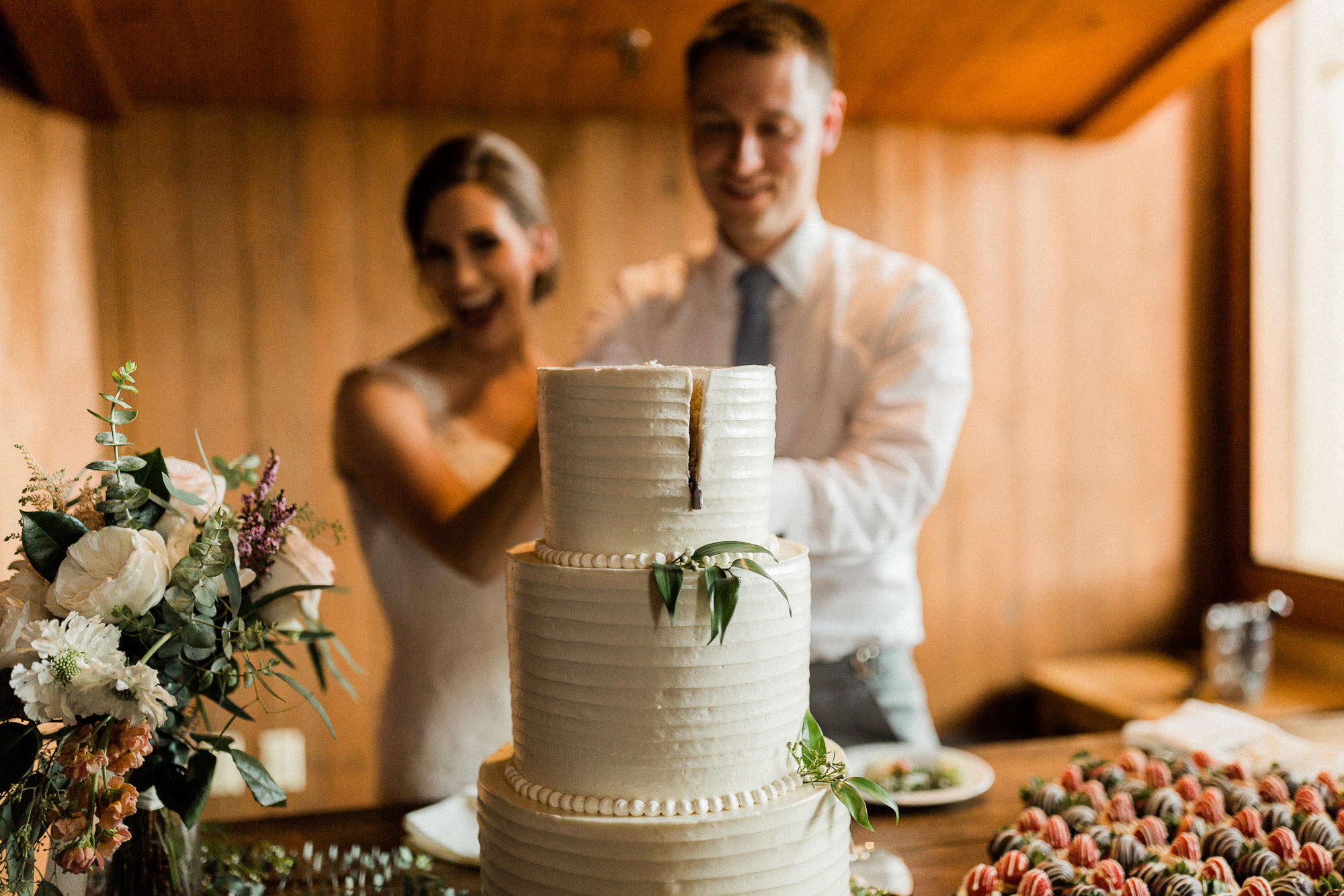 Bride and groom cut their cake at Black Butte Ranch in Central Oregon 