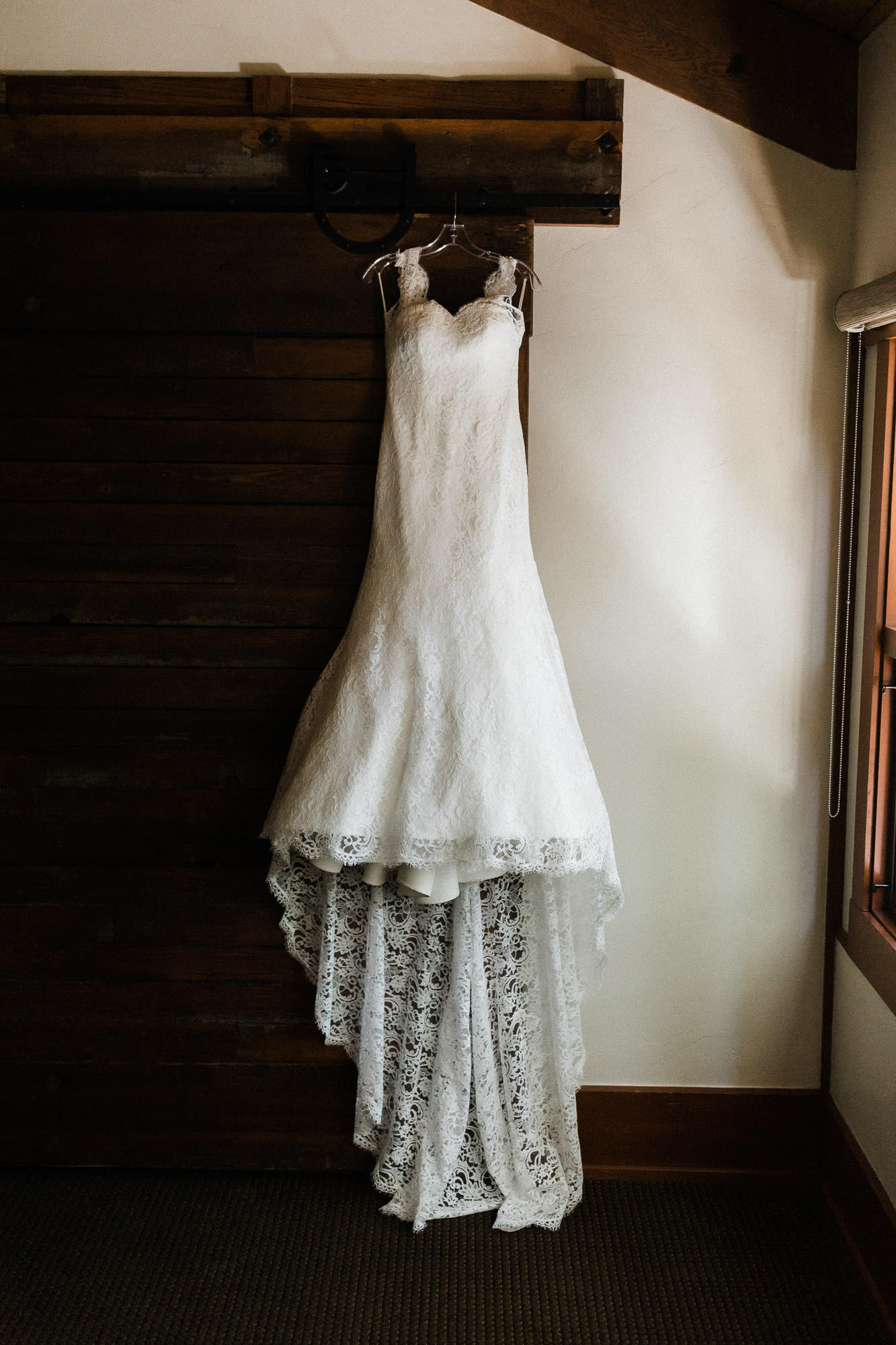 Bride's dress hangs on the wall at Black Butte Ranch Oregon