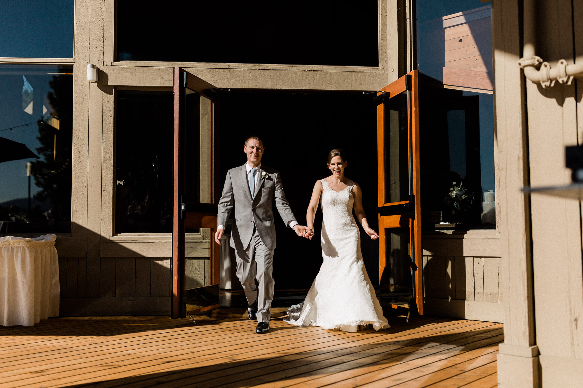 Bride and groom make their grand entrance to their wedding reception