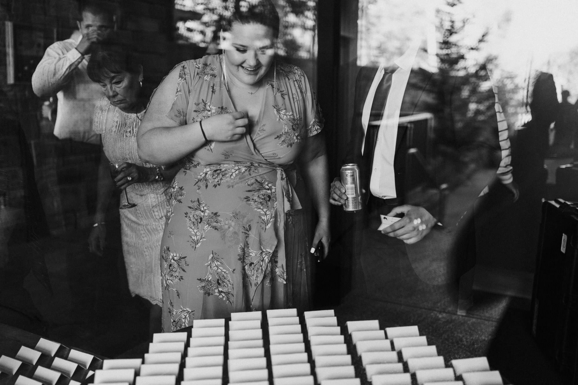 Guests find table assignments at wedding at Broken Top Club in Bend, Oregon