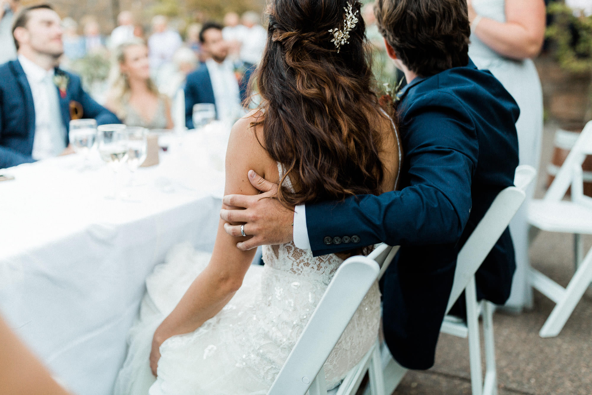 Bride and groom listen to toasts at Broken Top Club in Bend, Oregon