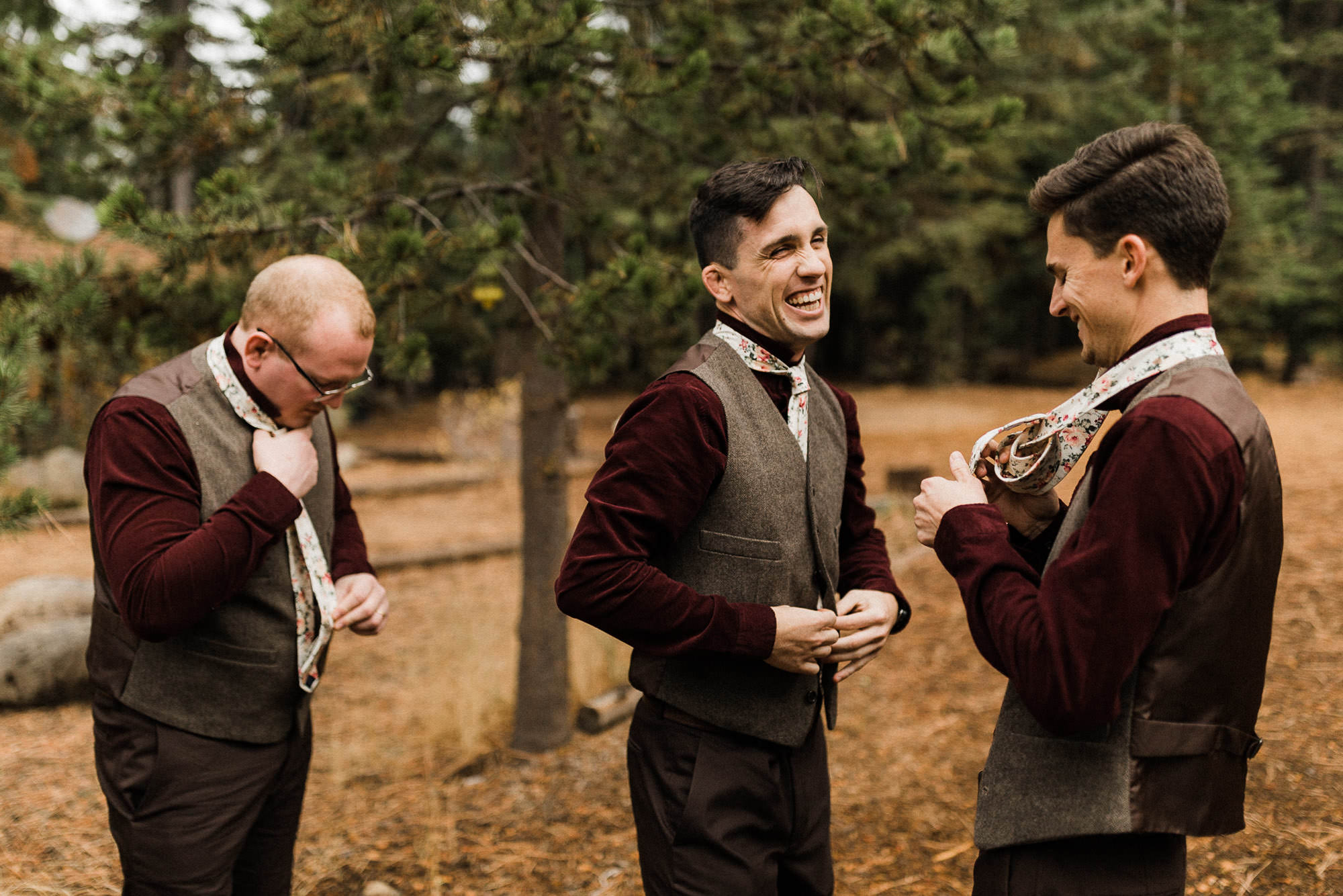 Groomsmen put on ties and vests at Skyliner Lodge in Bend, Oregon