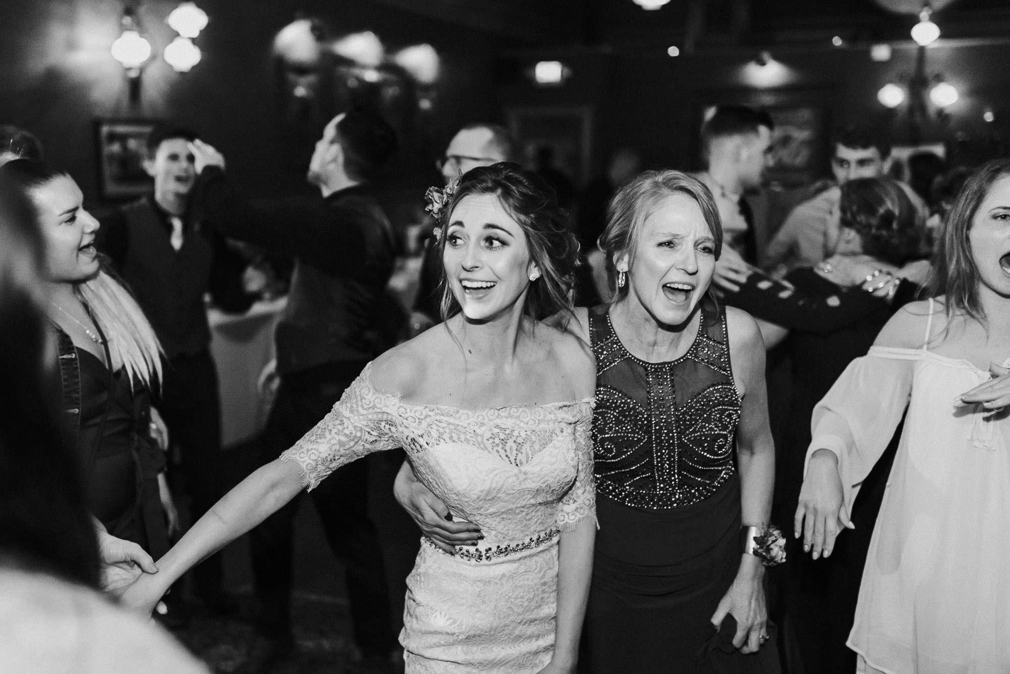 Bride and mom dance at wedding at McMenamin's Old St. Francis School in Bend