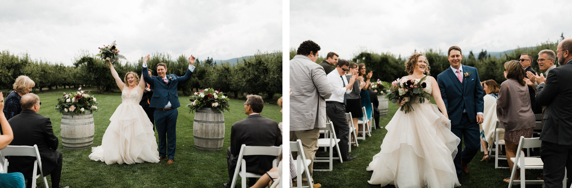 The bride and groom lift their arms in celebration as they recess down the aisle.