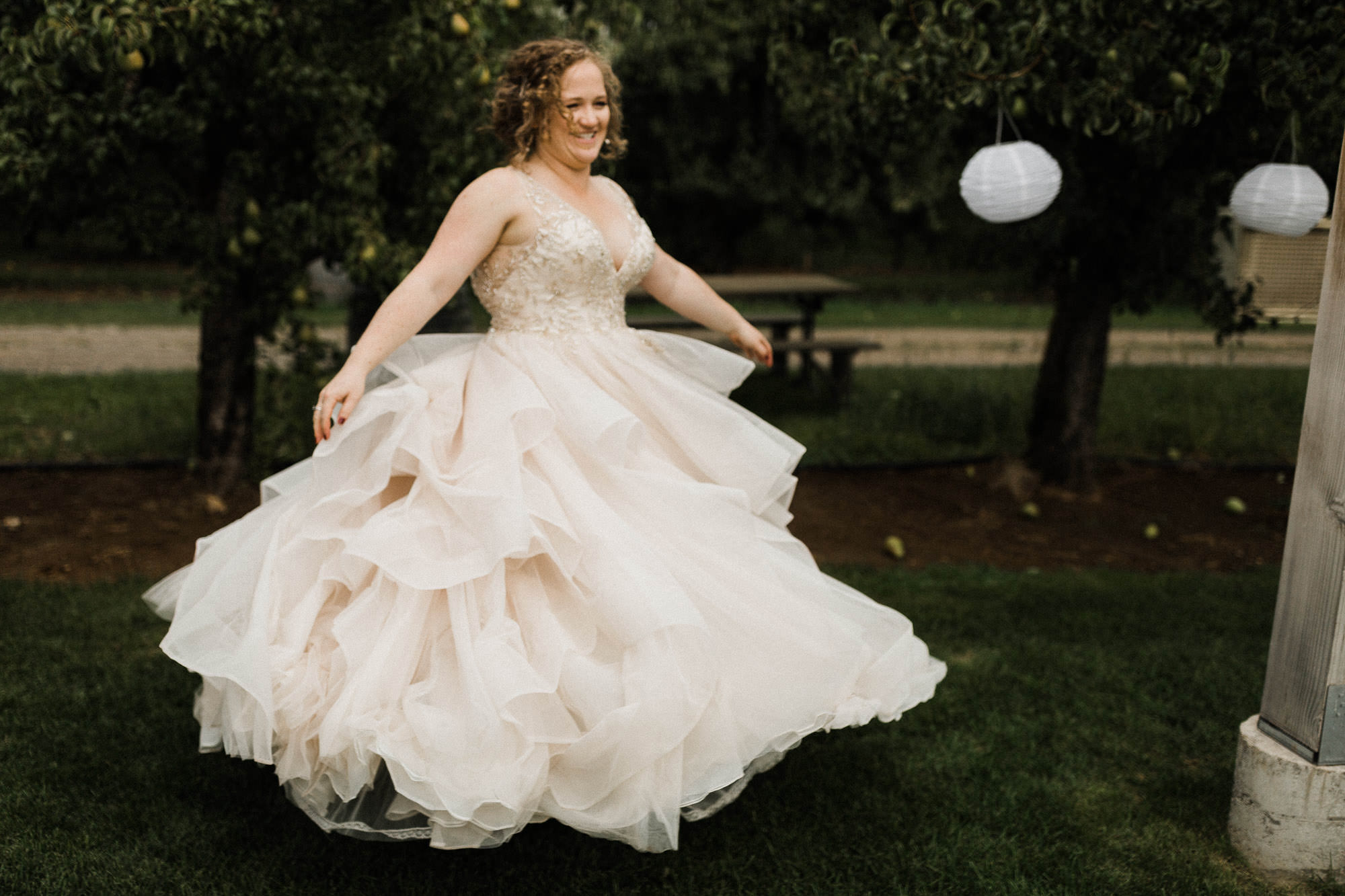 The bride spins in her dress at Mt. View Orchards.