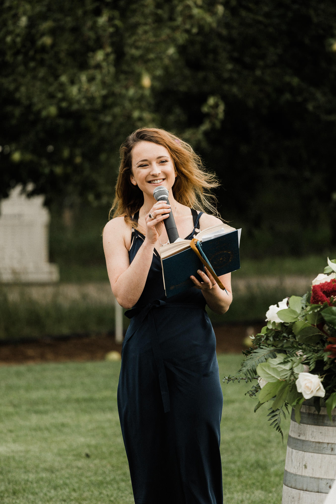 A wedding guest gives a reading during the ceremony at Mt. View Orchards.