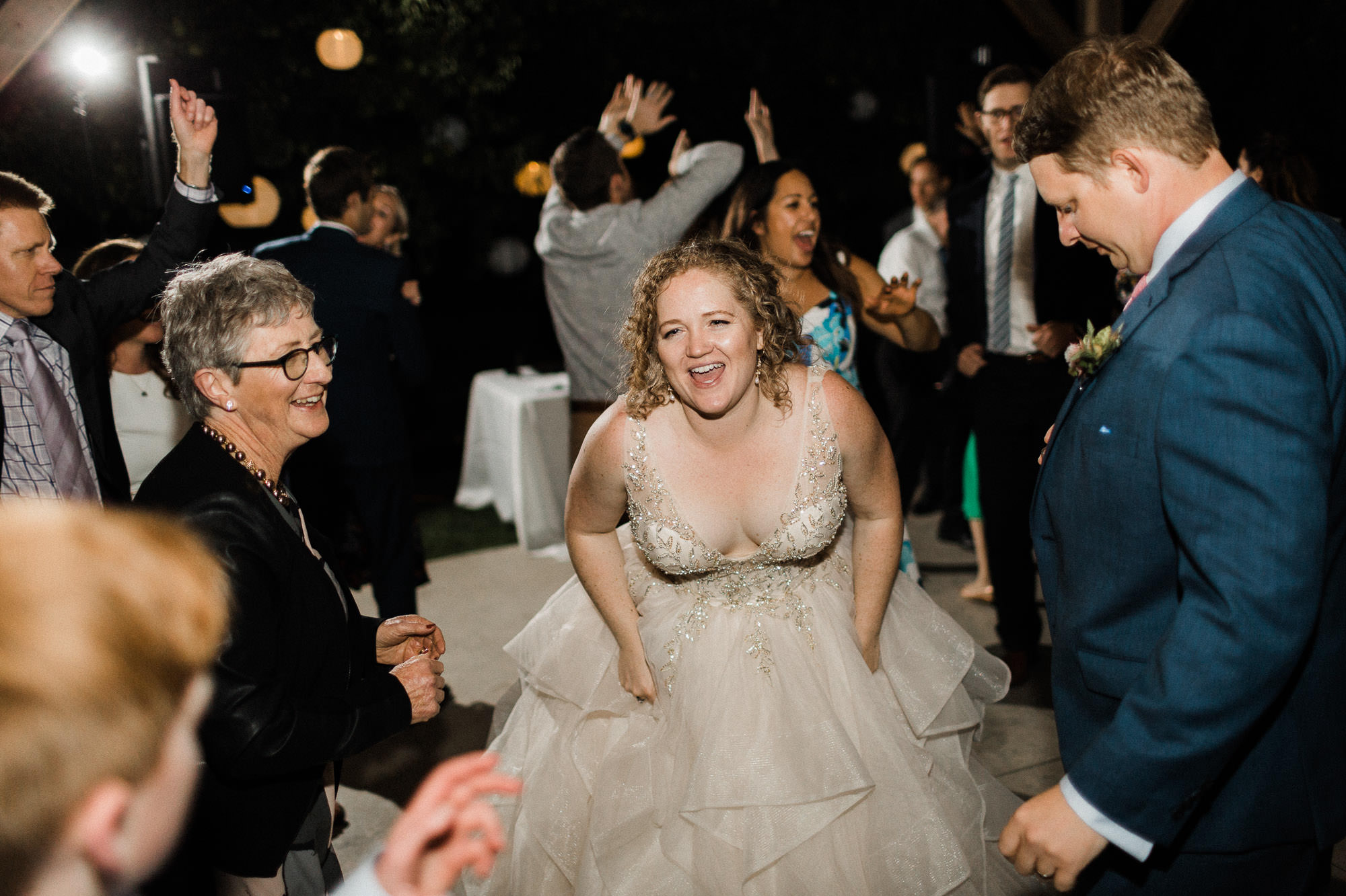 The bride and groom dance with guests at Mt. View Orchards in Oregon.