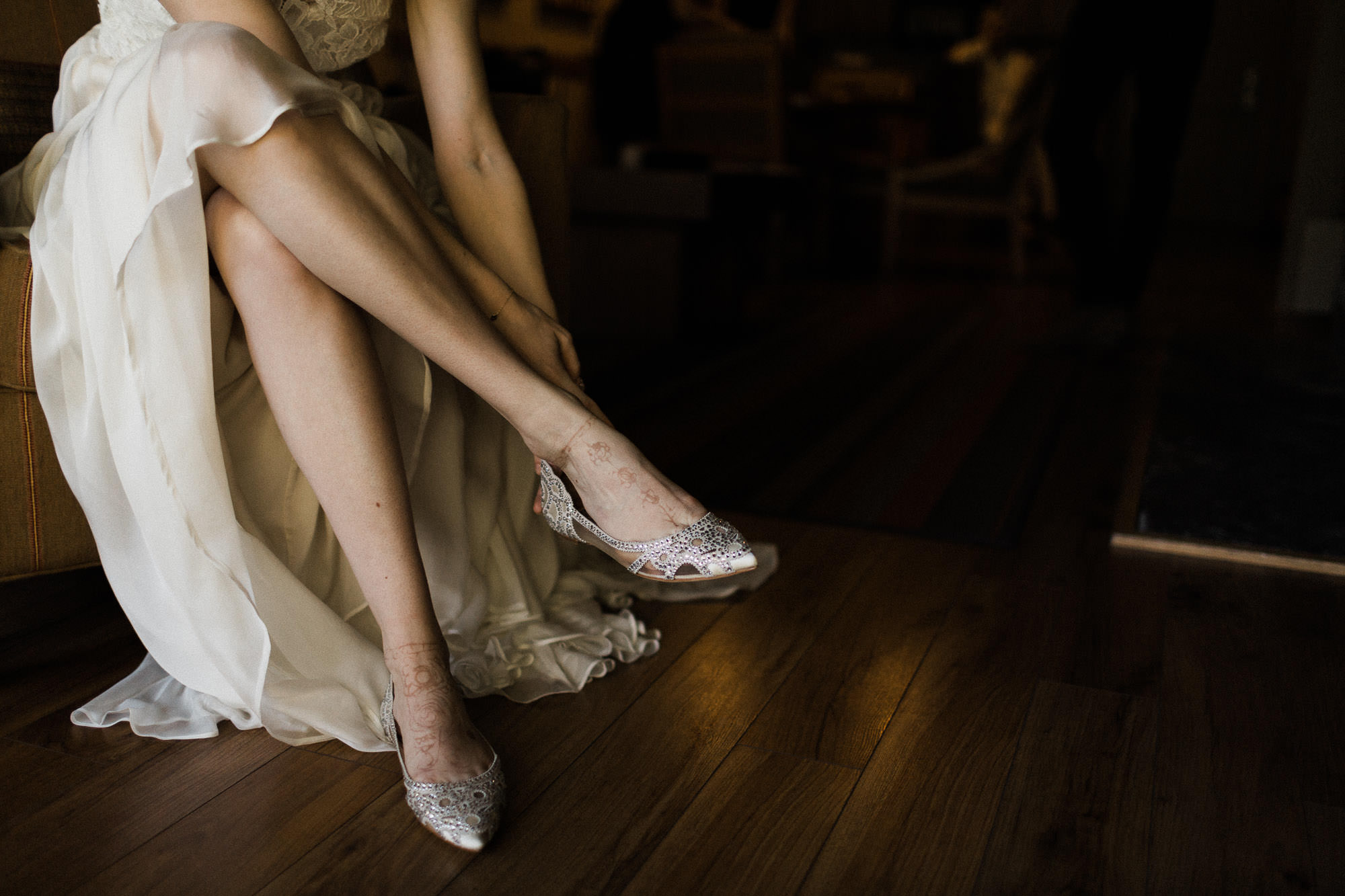 The bride puts her shoes on at Sunriver Resort in Oregon