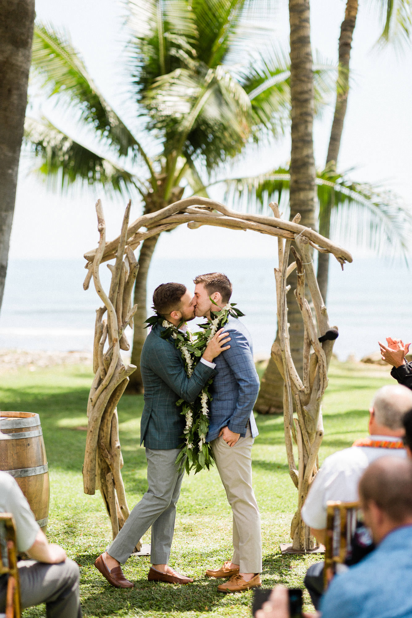 groom-kisses-groom-gay-wedding-olowalu-plantation 