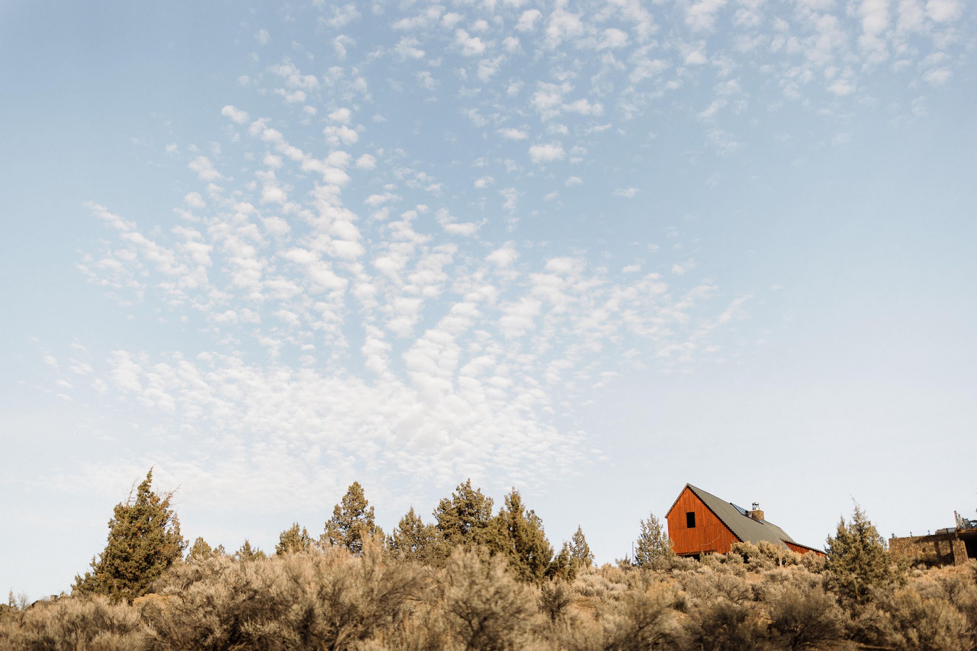 The Barn Venue at Brasada Ranch, blue skies with only small clouds. The perfect fall morning.