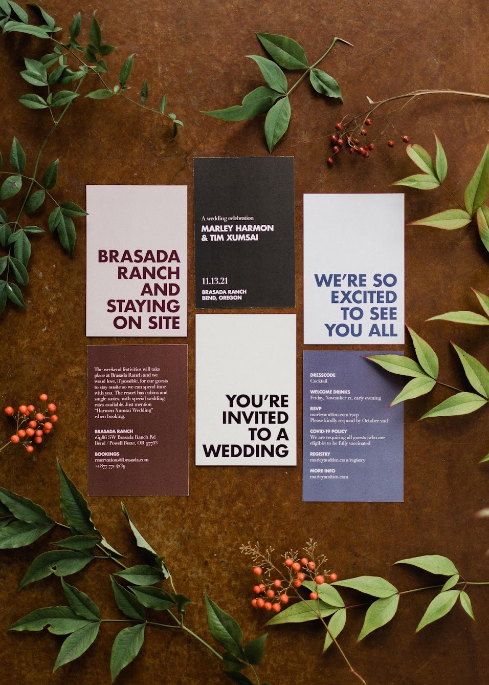 wedding invitation suite for a Brasada Ranch wedding surrounded by decorative leaves and berries