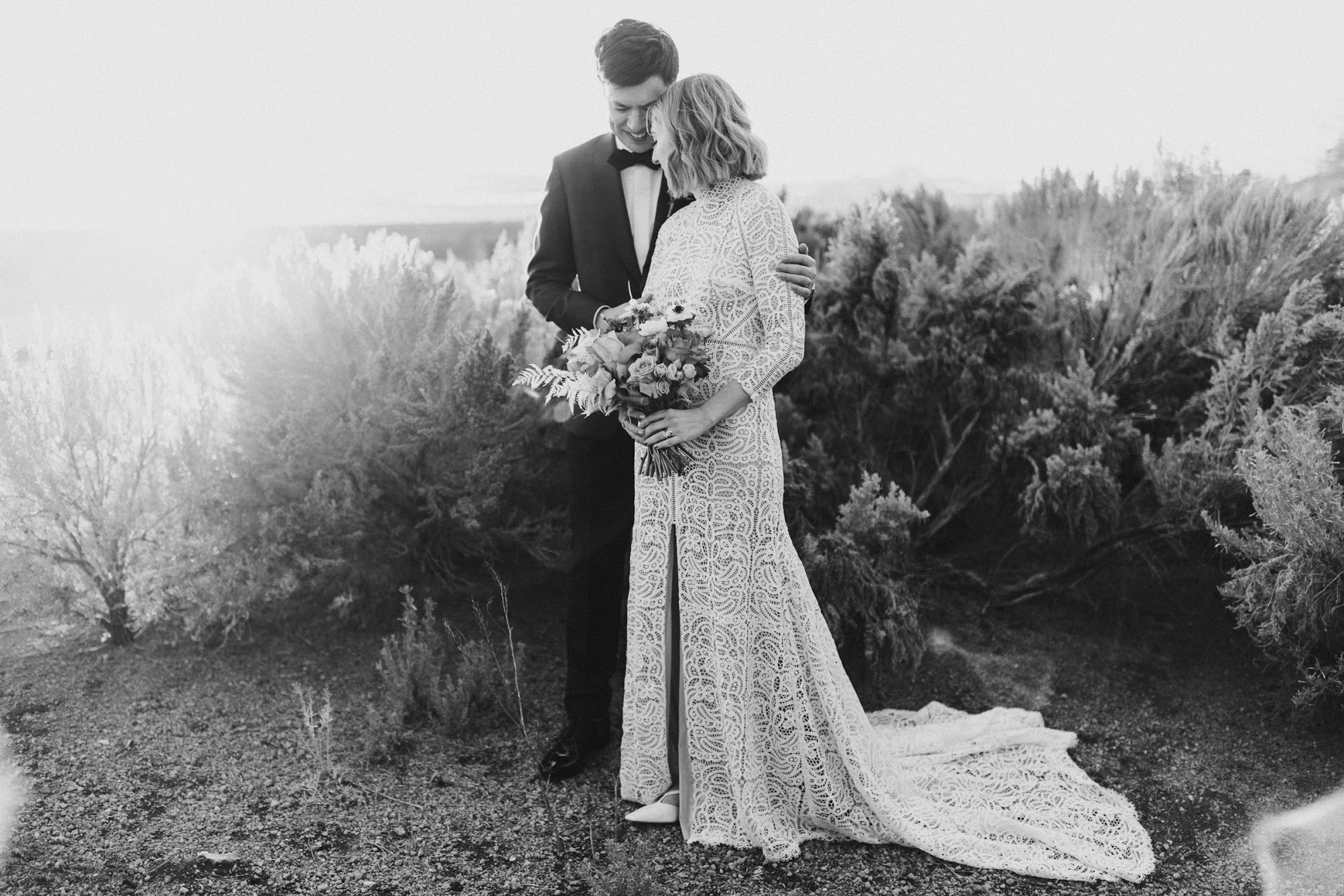Bride and groom holding each other