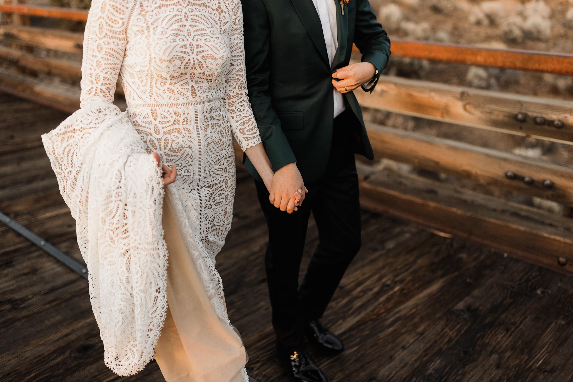 holding hands on the bridge 