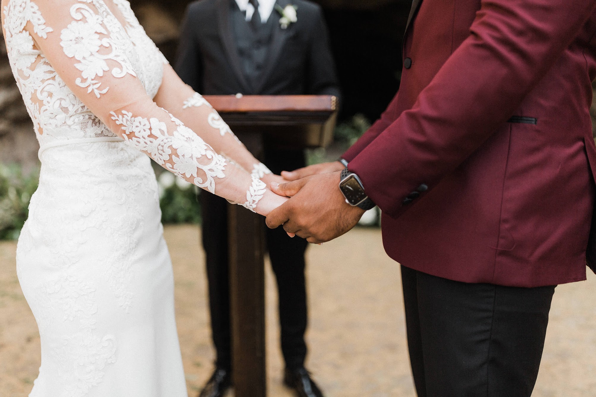 up close of the couple holding hands.