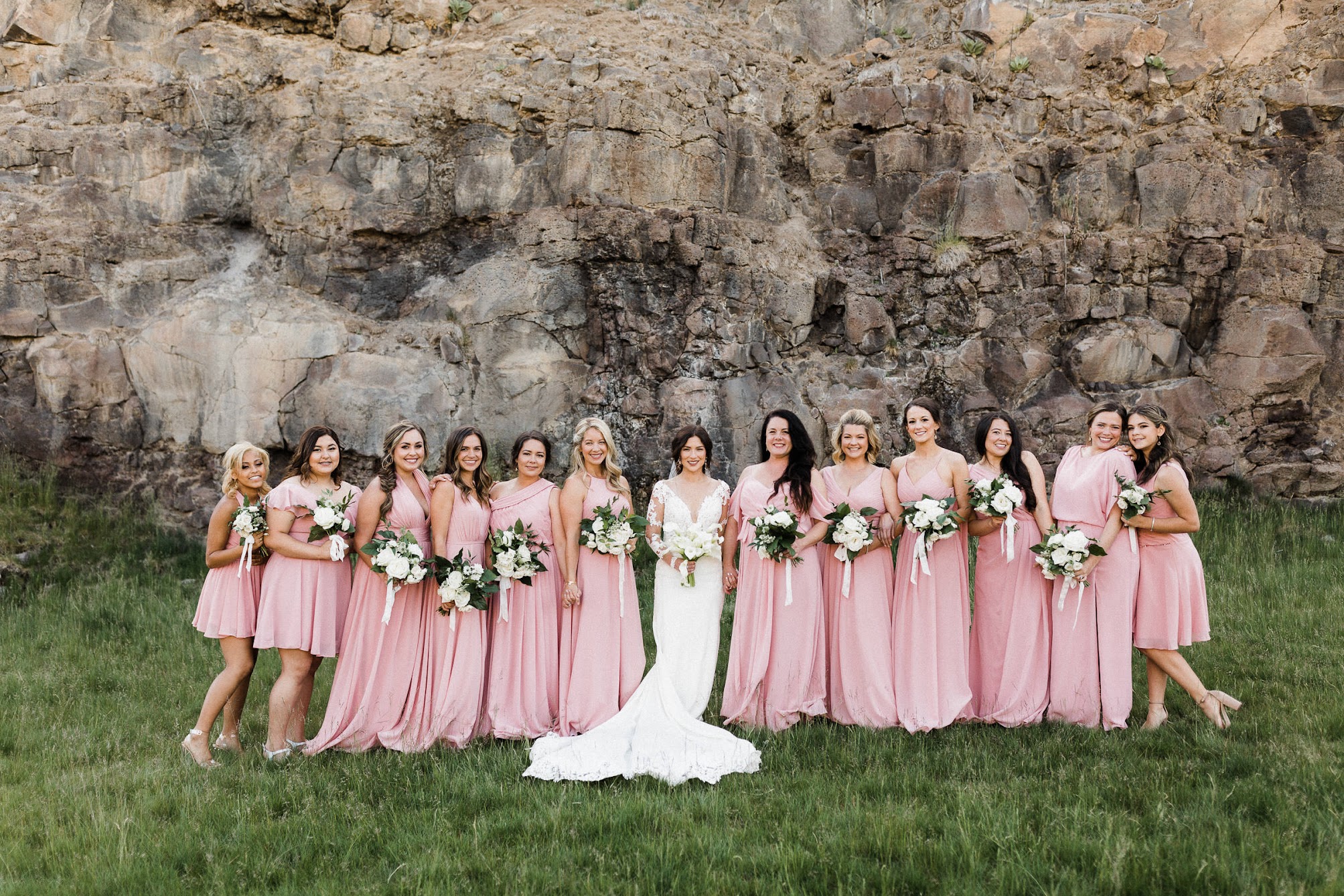 all the bridesmaids and the bride are lined up.