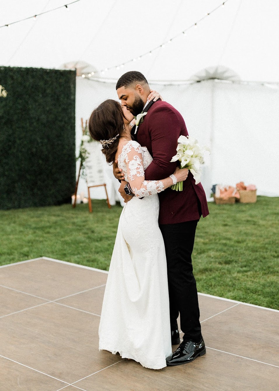 the couple first dance, sharing a beautiful moment on the dance floor holding each other
