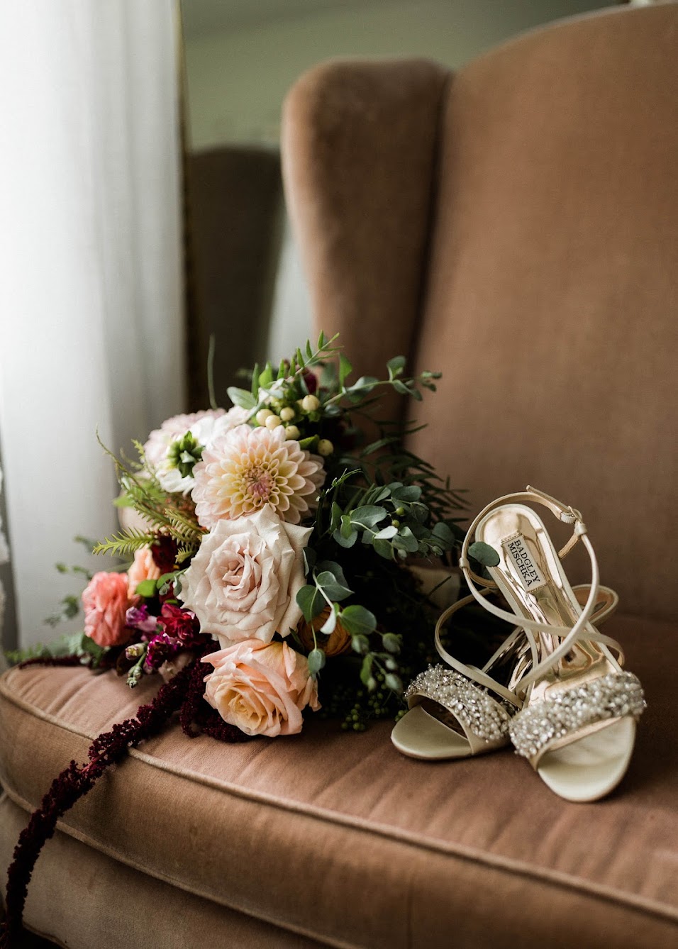Open toes heels sitting next to florals