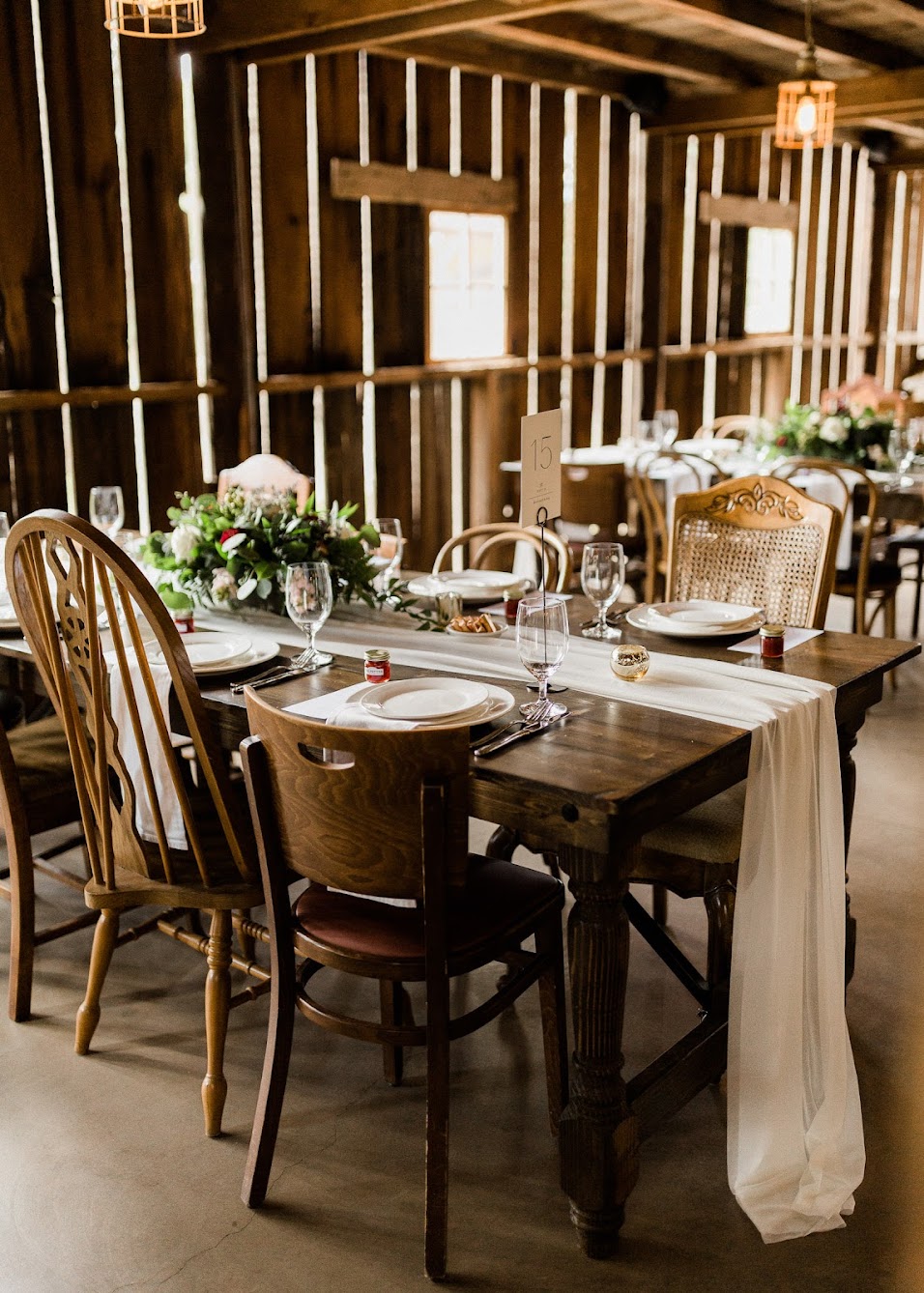 Guests tables with a running hanging off the sides
