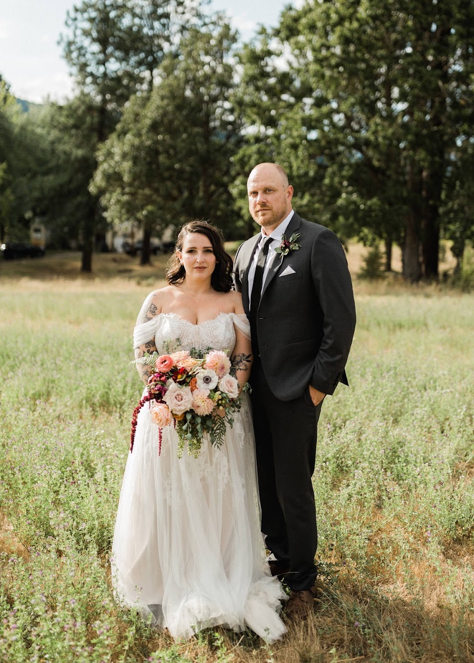 The couple looking serious, looking into the camera.