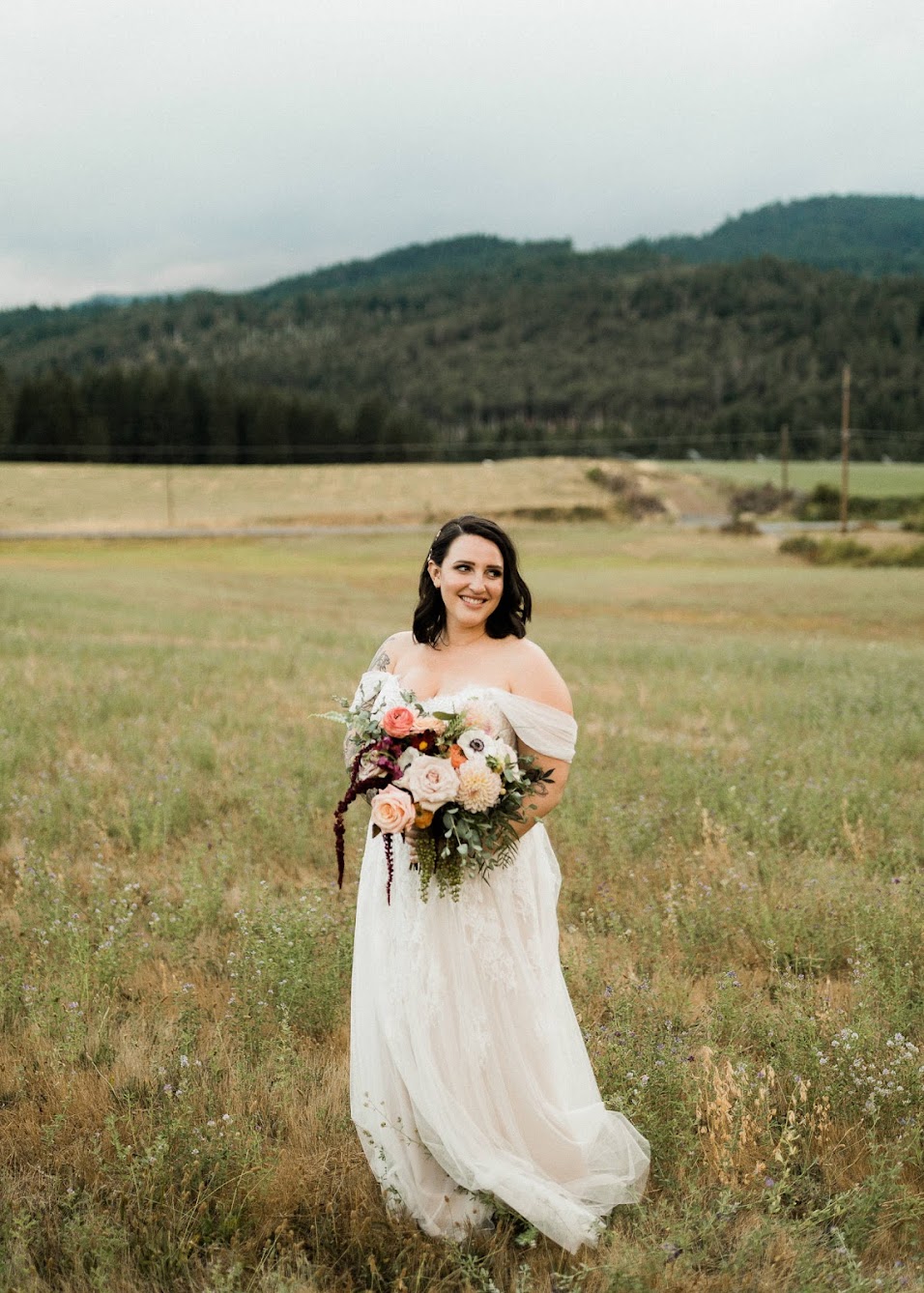 bride standing alone looking off to the side 