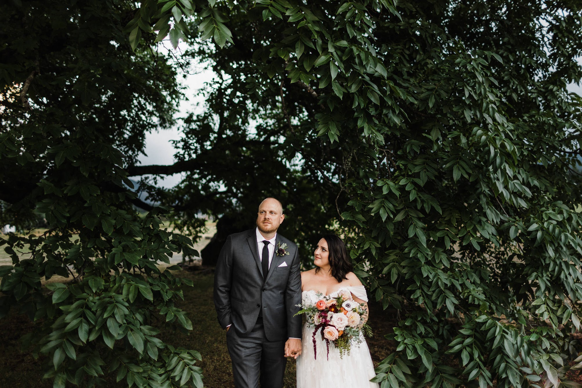 The couple using the tree as the perfect backdrop 