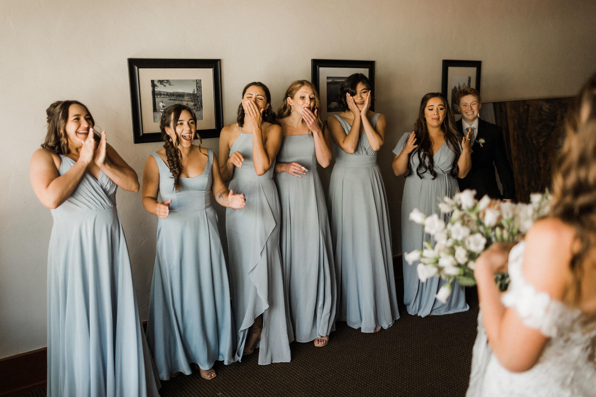bridesmaids all looking at the bride