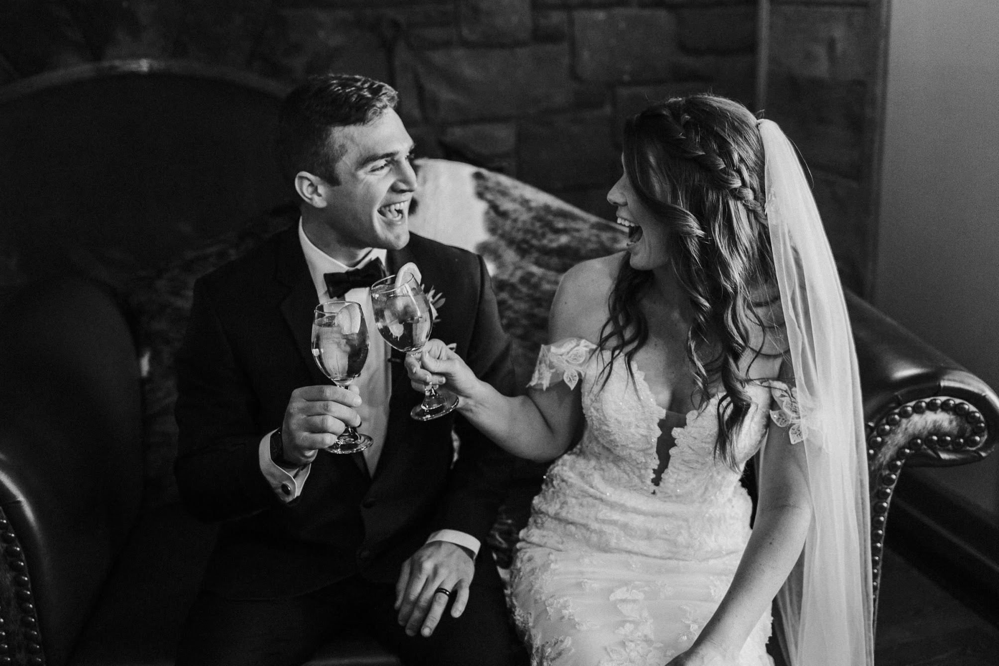 Bride and groom holding champagne glasses