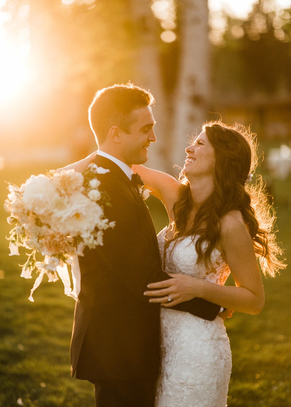 bride and groom taking sunset photos