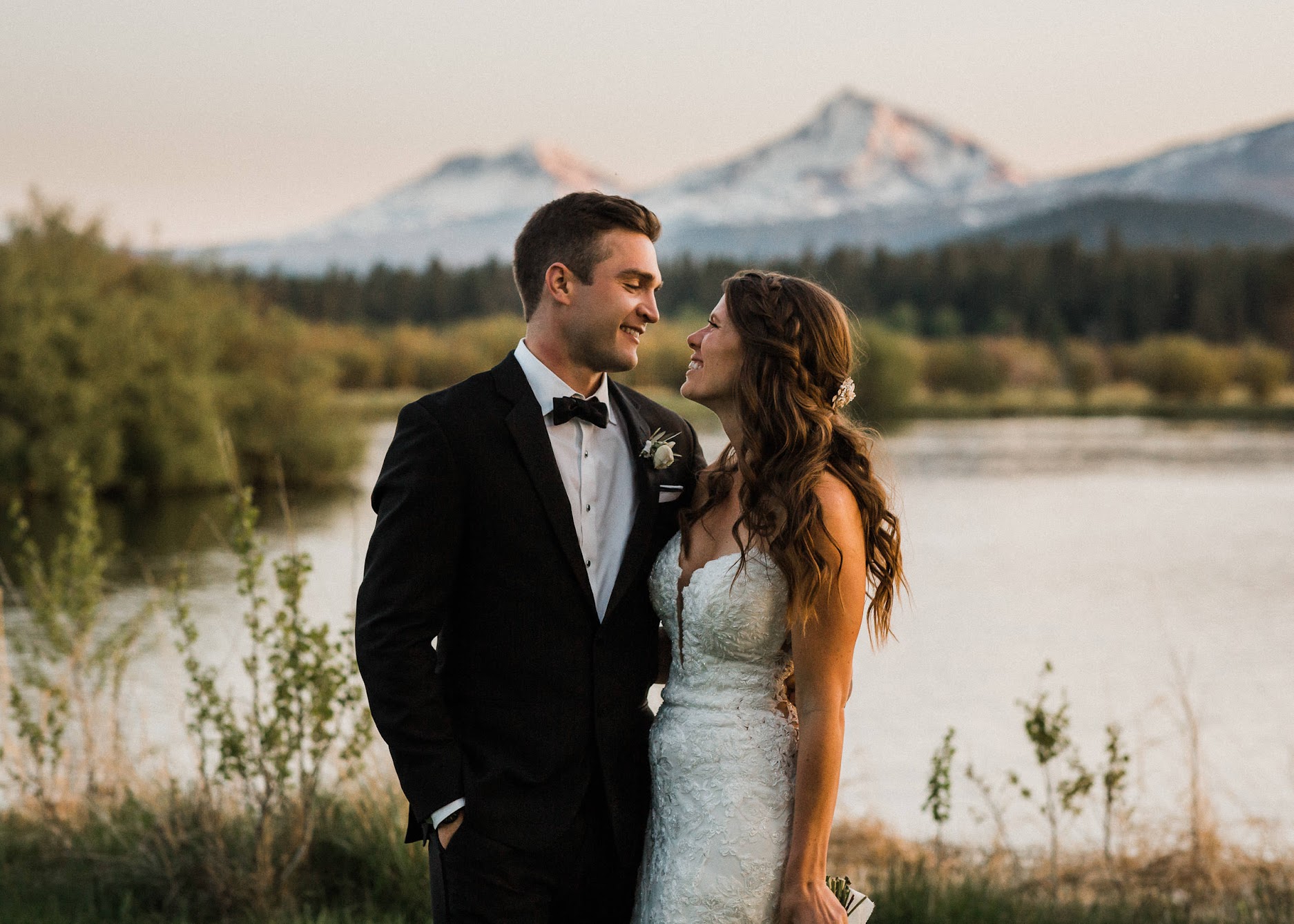 bride and groom looking into each others eyes 