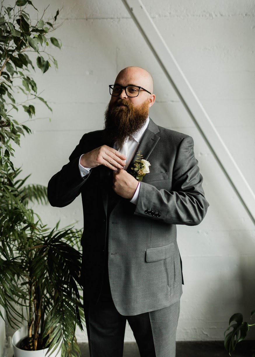 The groom fixing his tie 