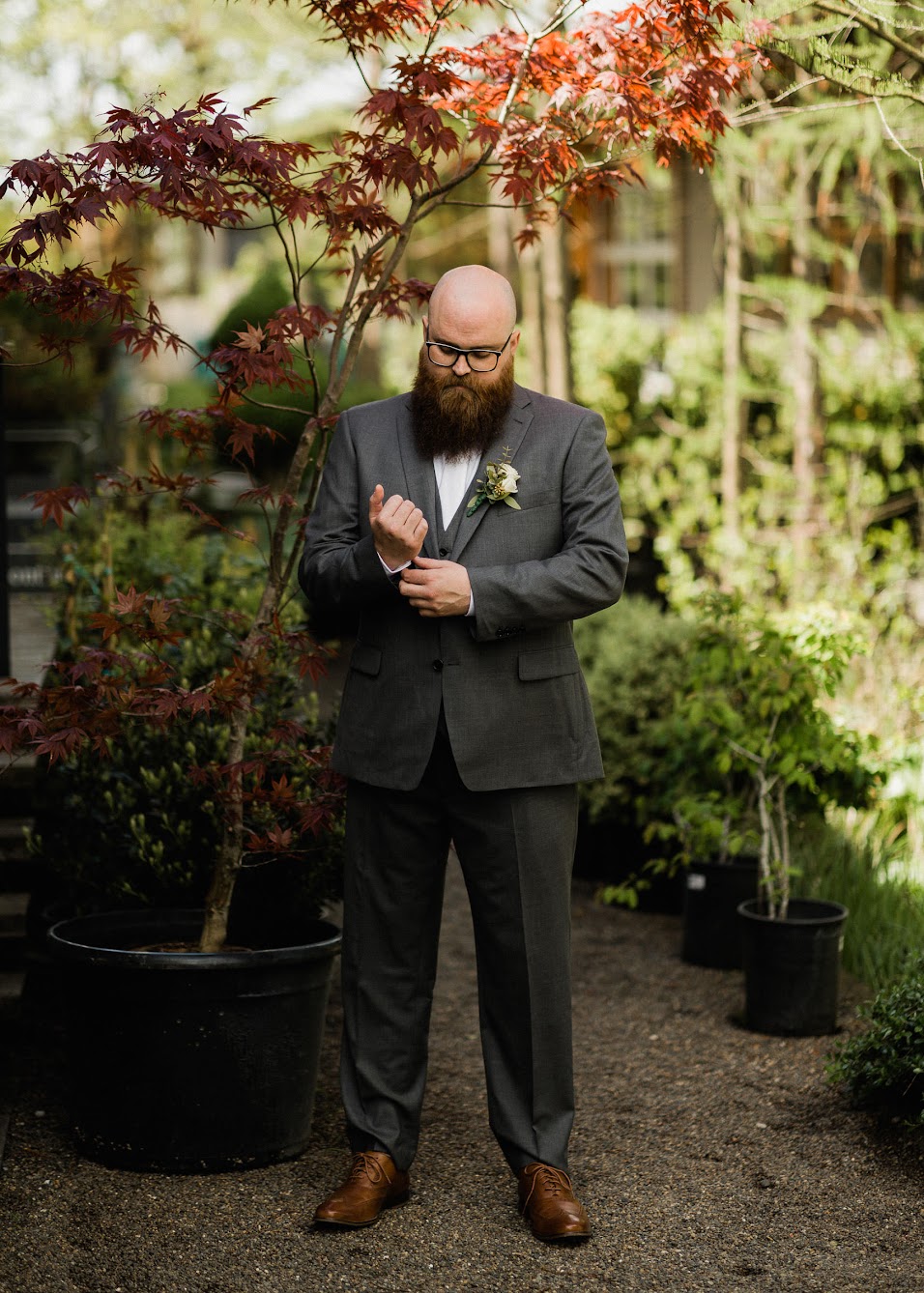 groom fixing his sleeve