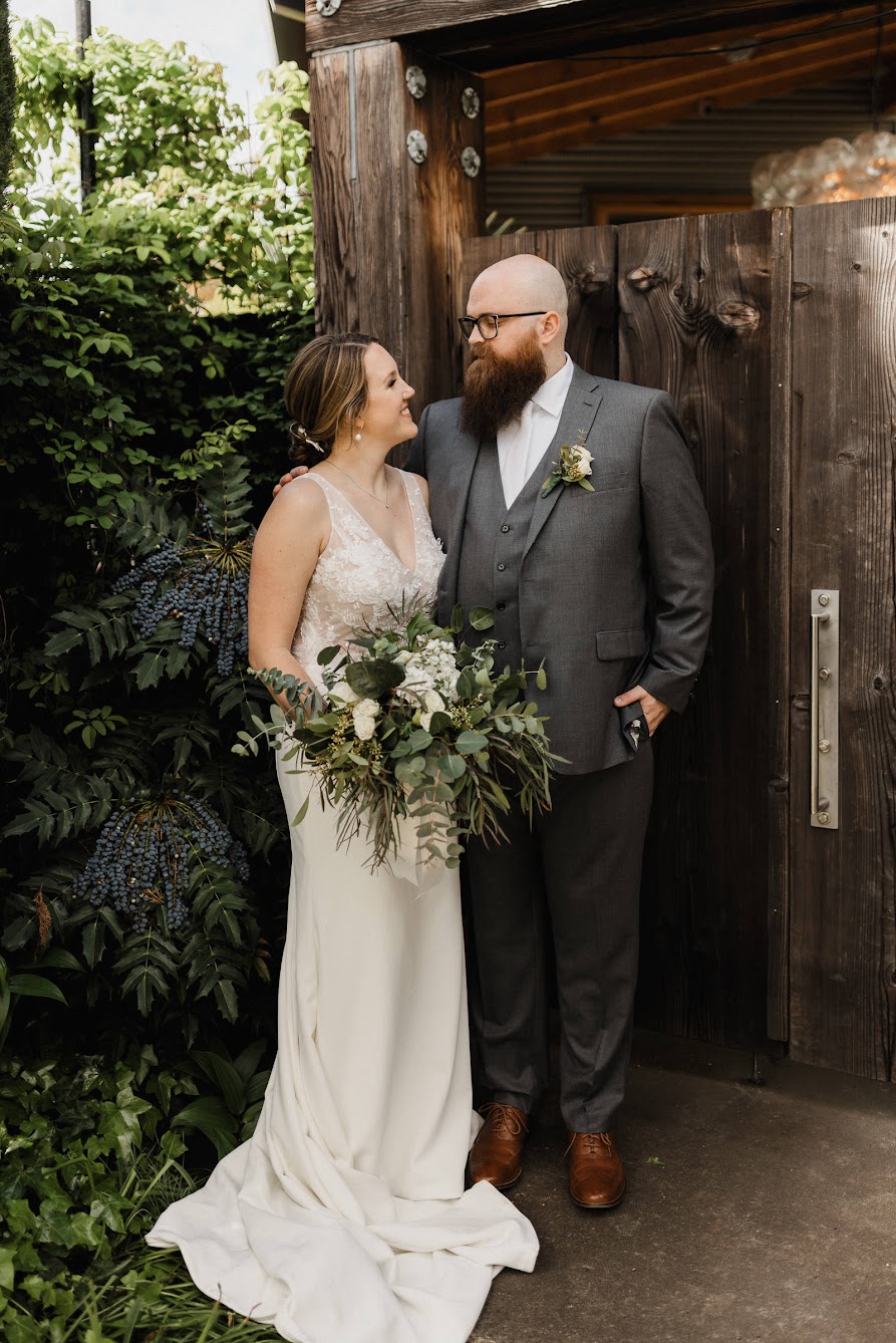 the couple looking at each other with a smile 