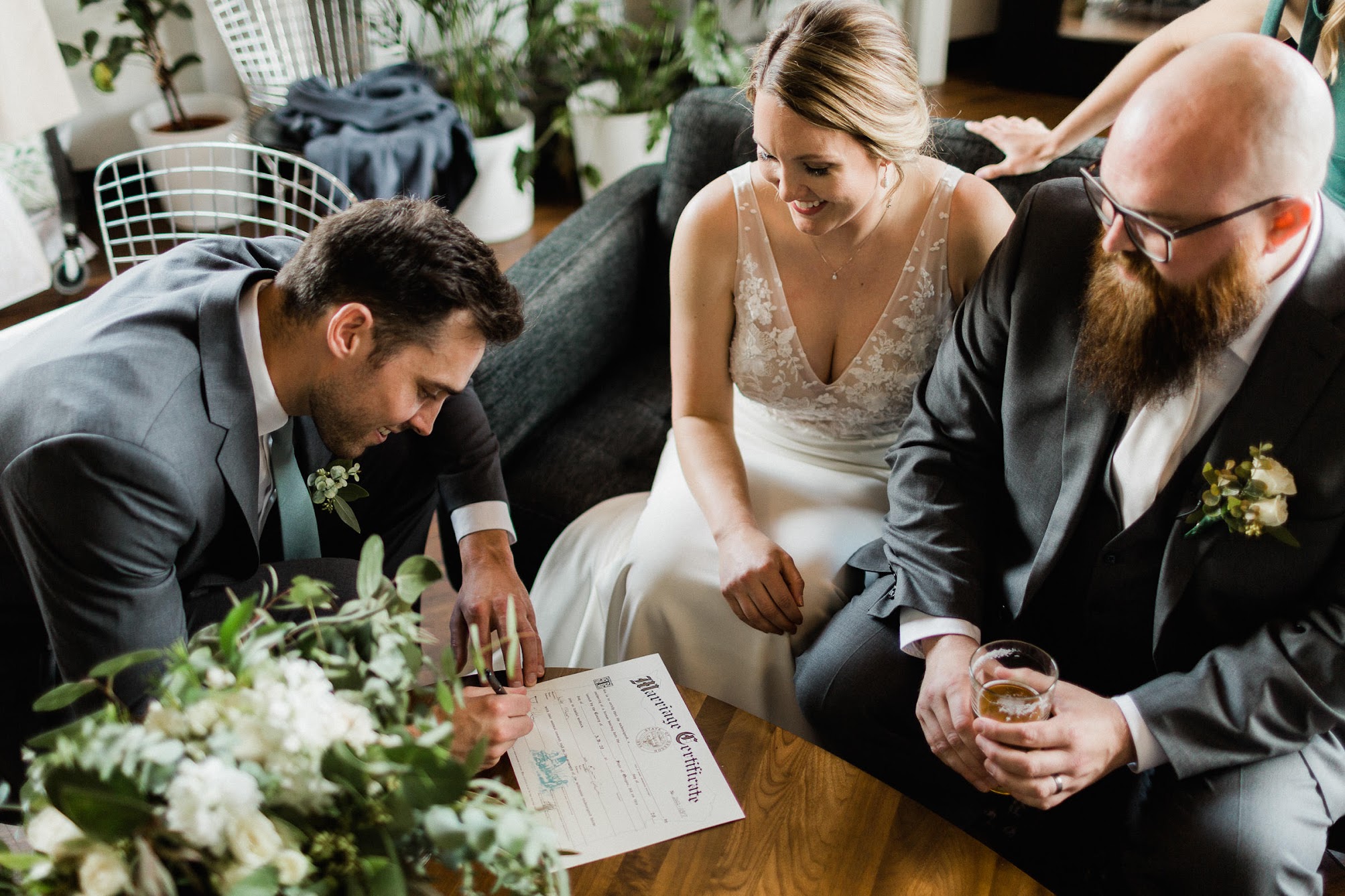 bride and groom signing the marriage license 