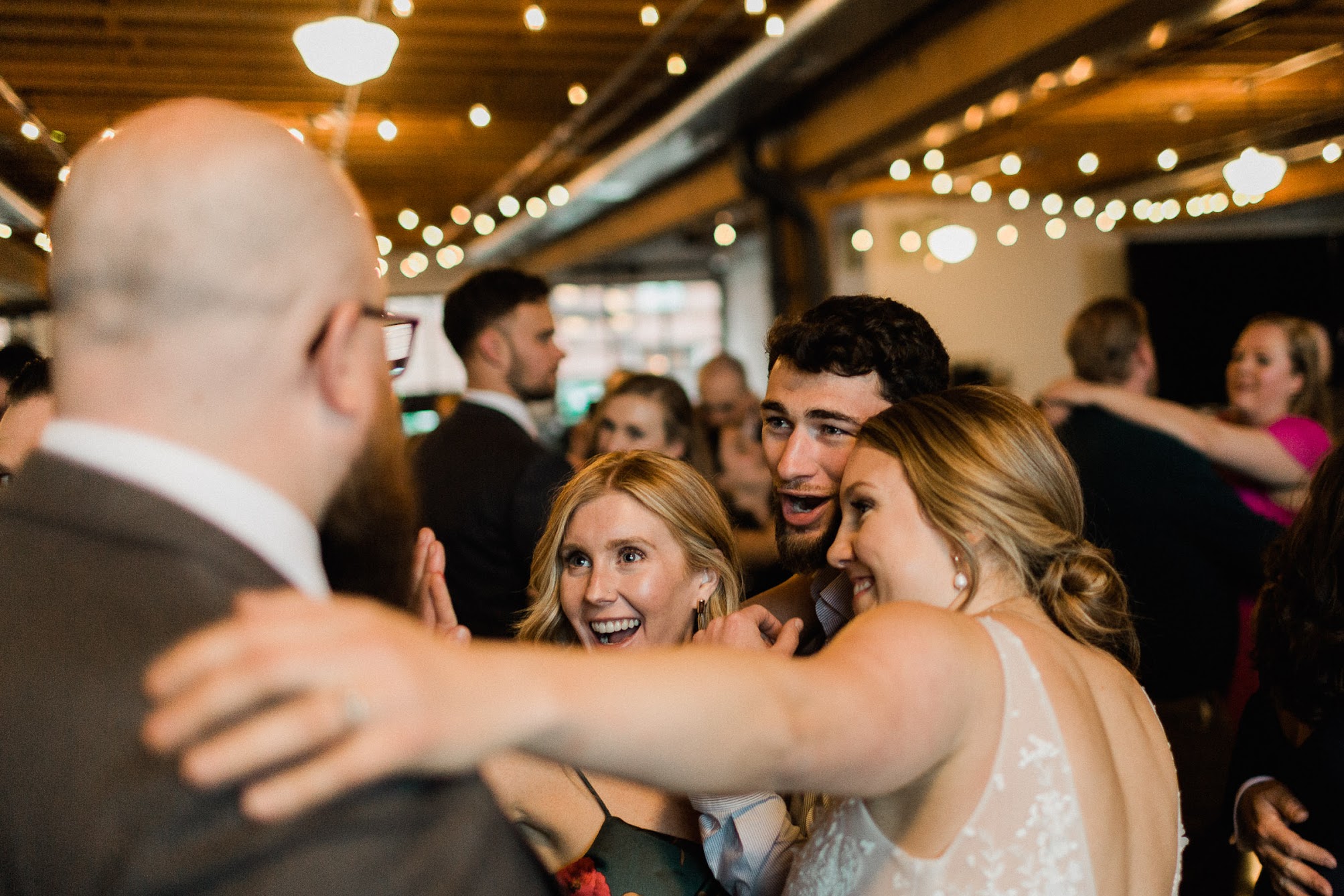 bride and groom talking with their guests 
