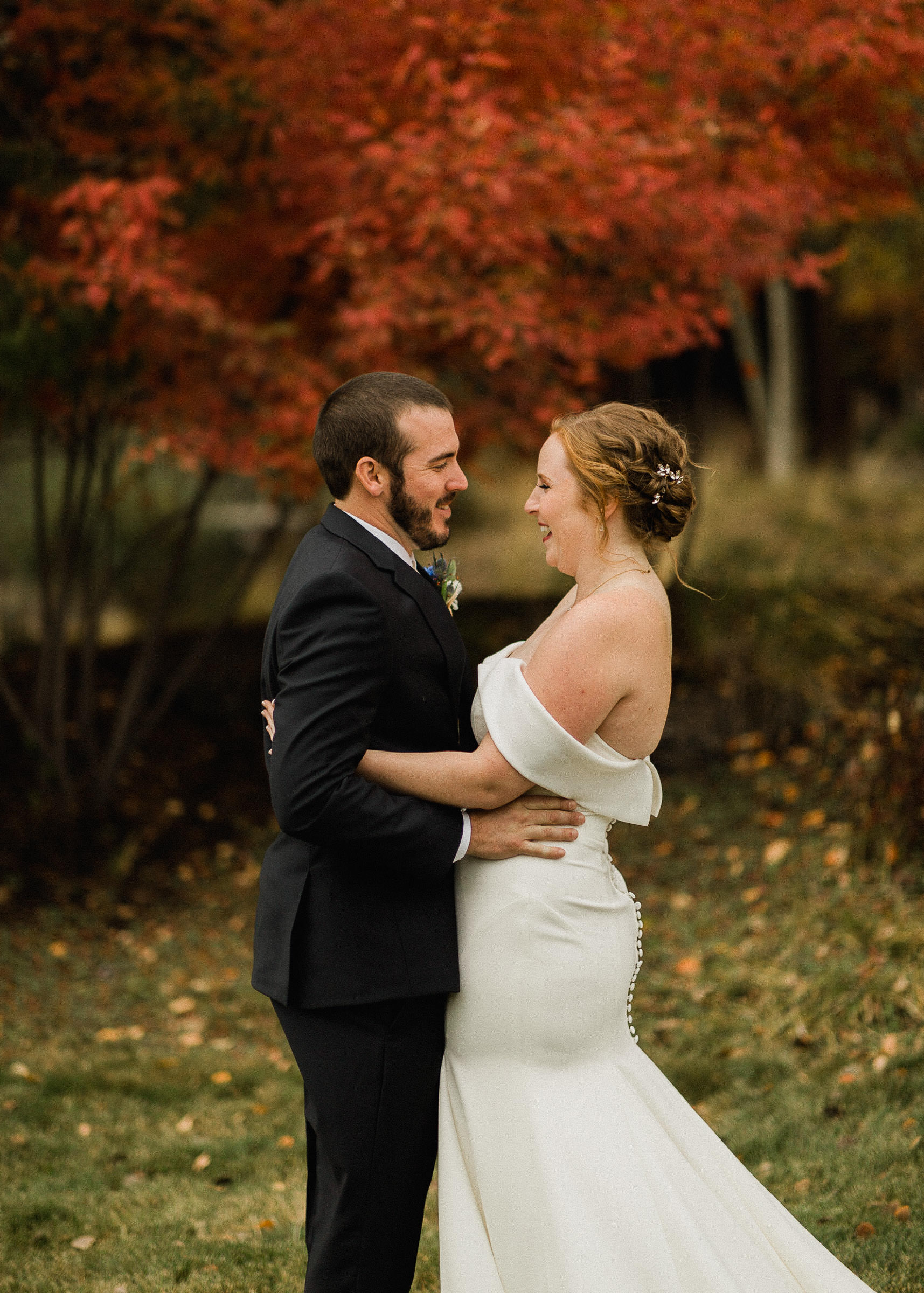 Bride and groom smile as they see each other for the first time on wedding day