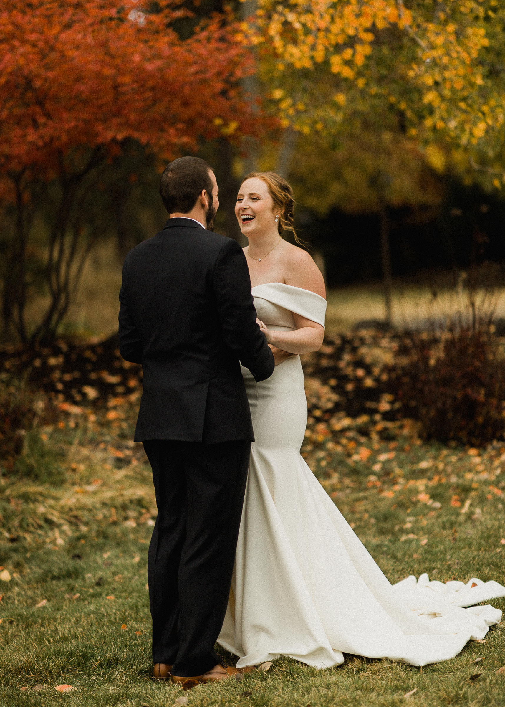 Bride smiles as she sees groom for the first time on wedding day