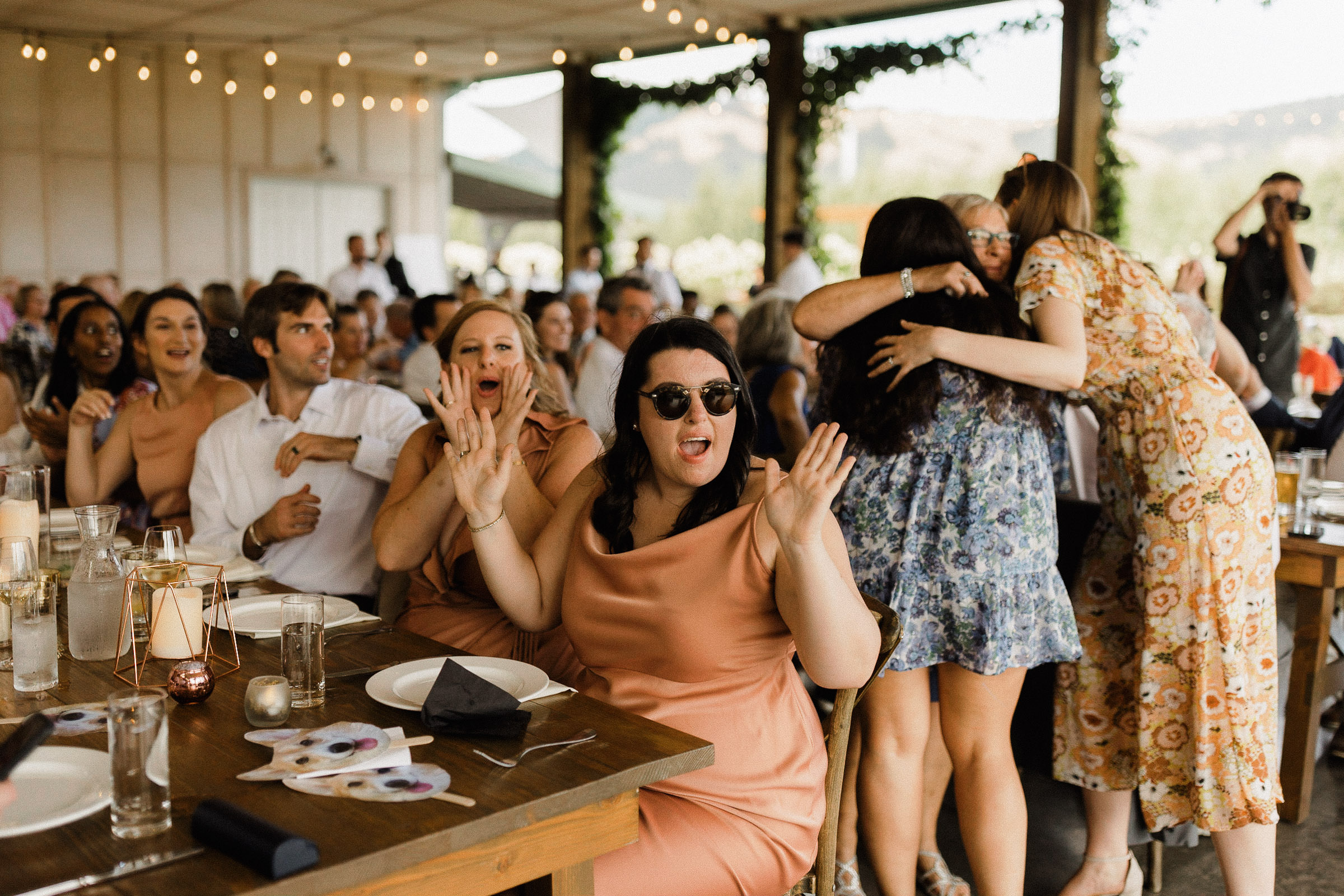 Guests cheer for bride and groom's grand entrance