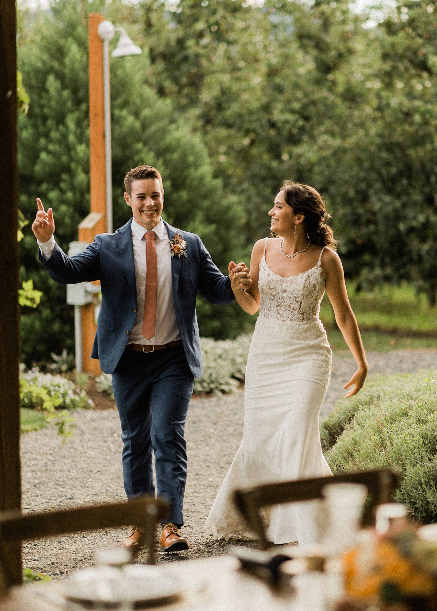 Bride and groom make their grand entrance to their wedding reception