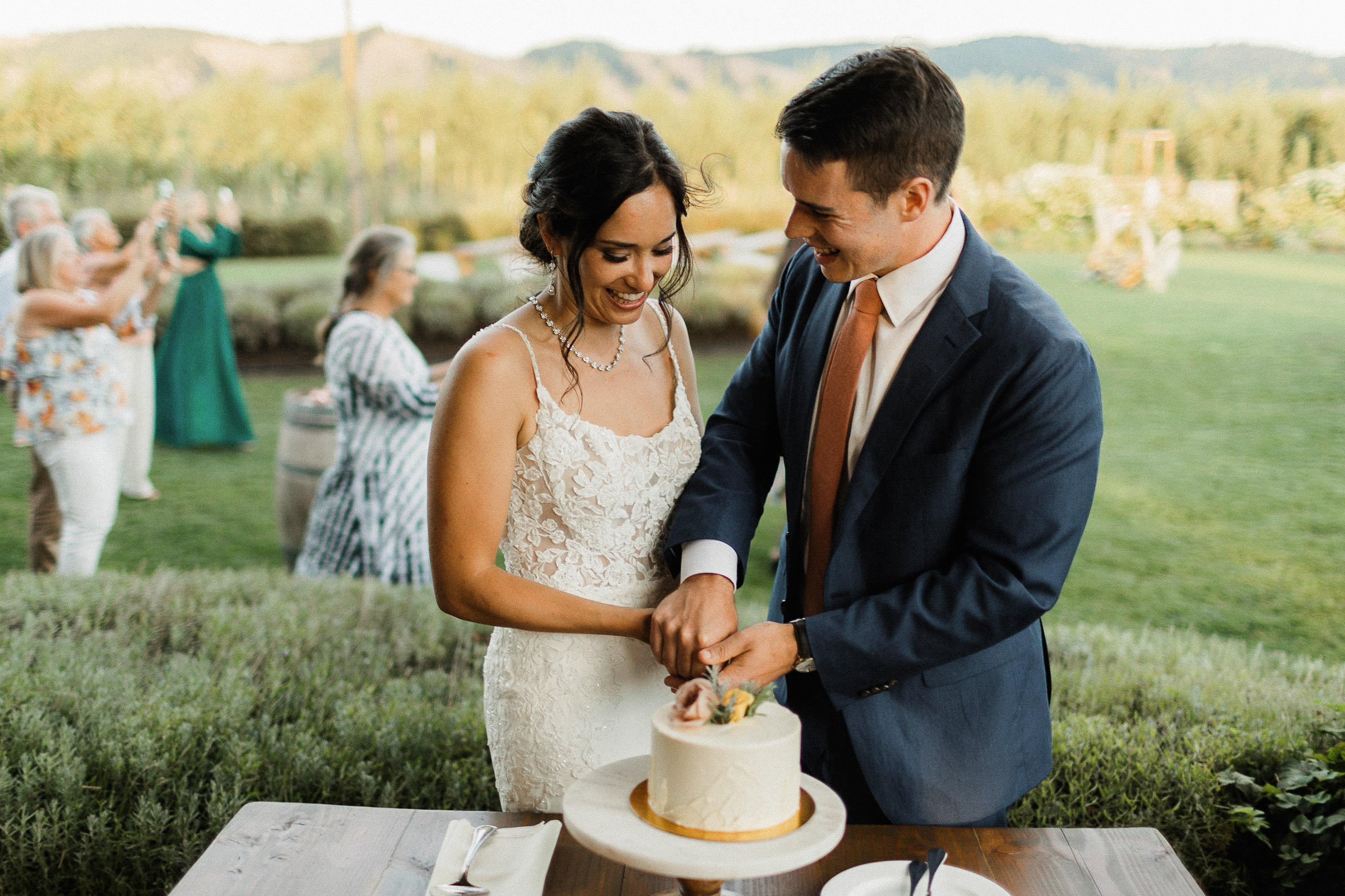 Bride and groom cut small cake