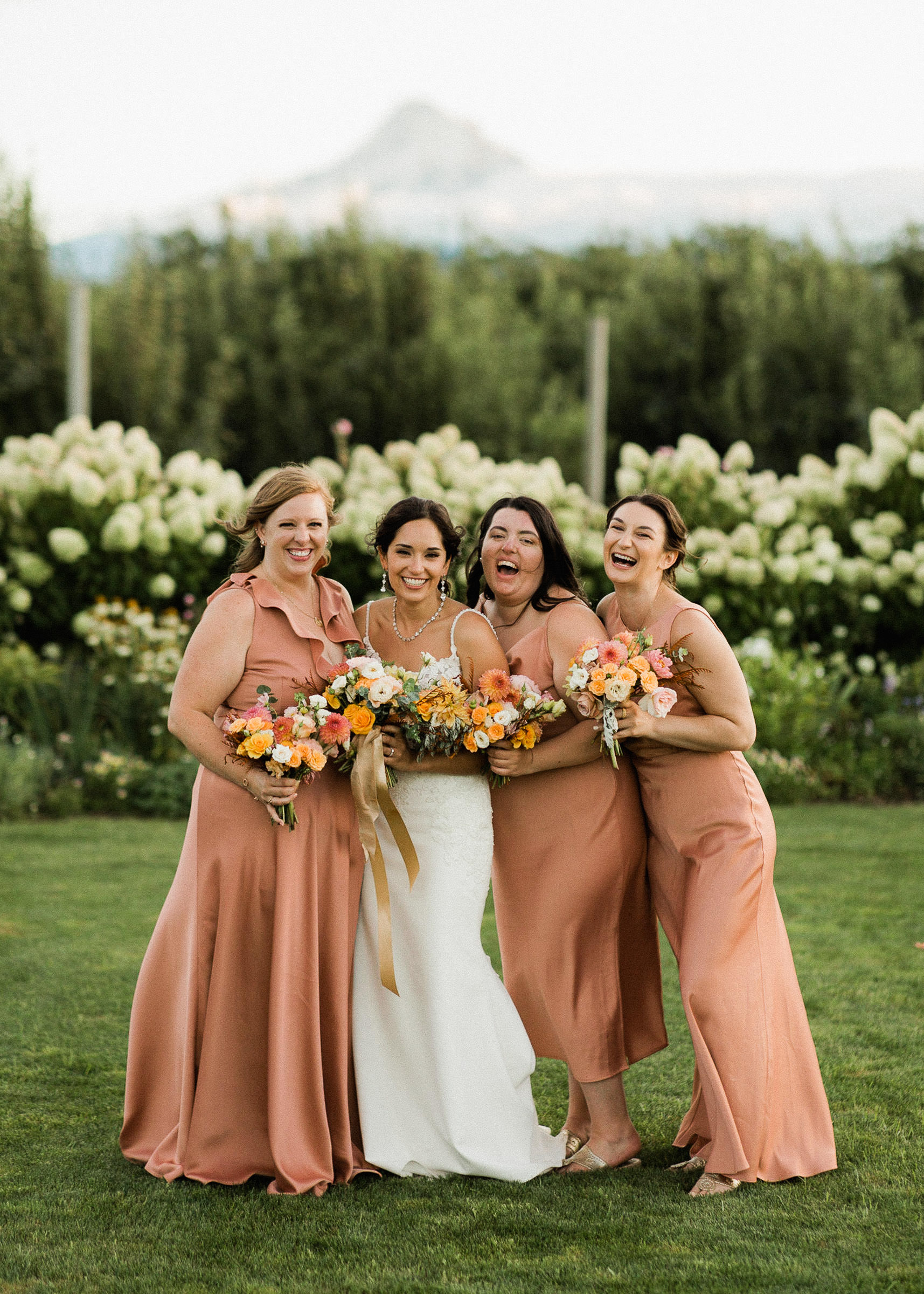 Bridal party pose with views of Mount Hood
