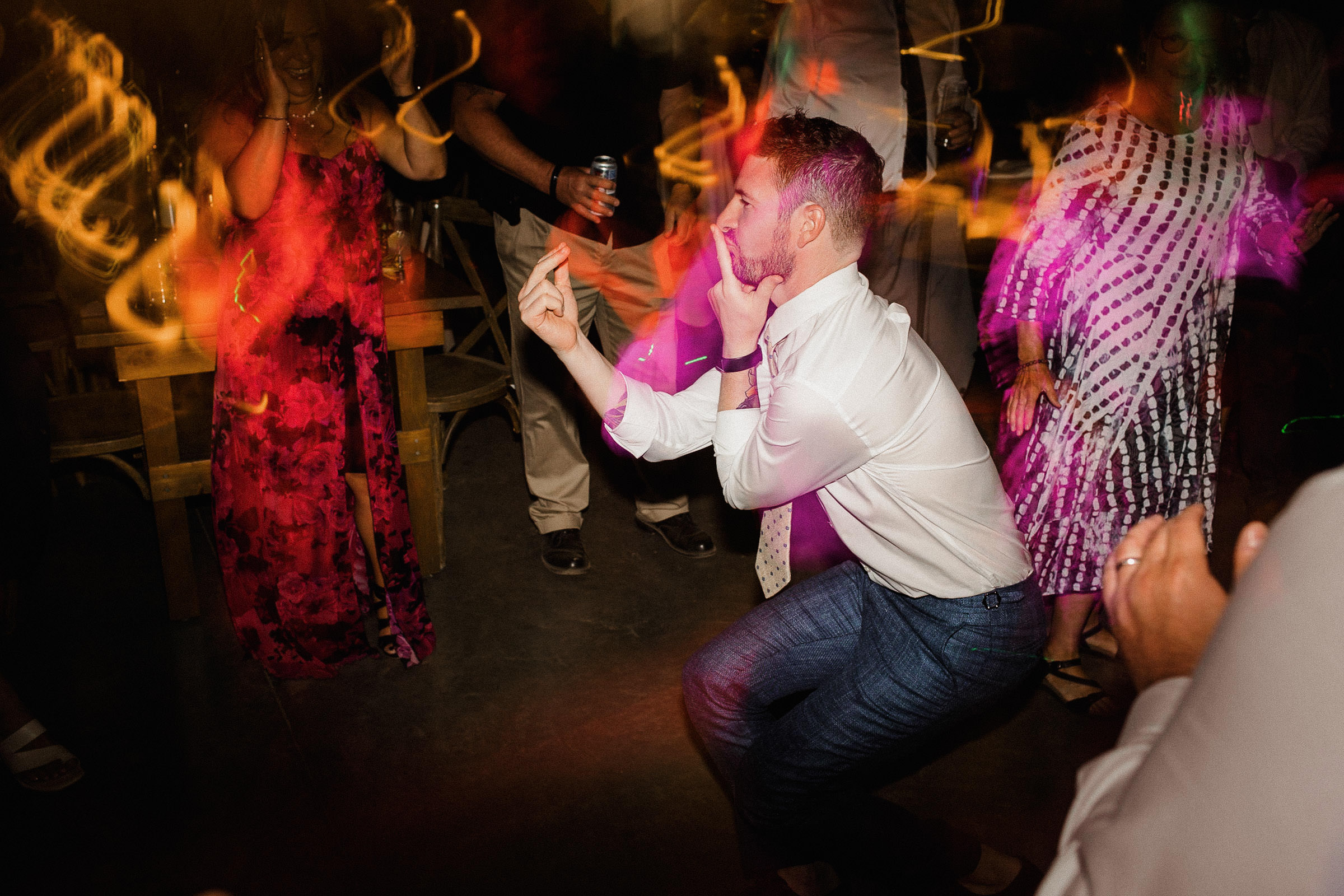 Guest mime lighting a cigarette while dancing on the dance floor