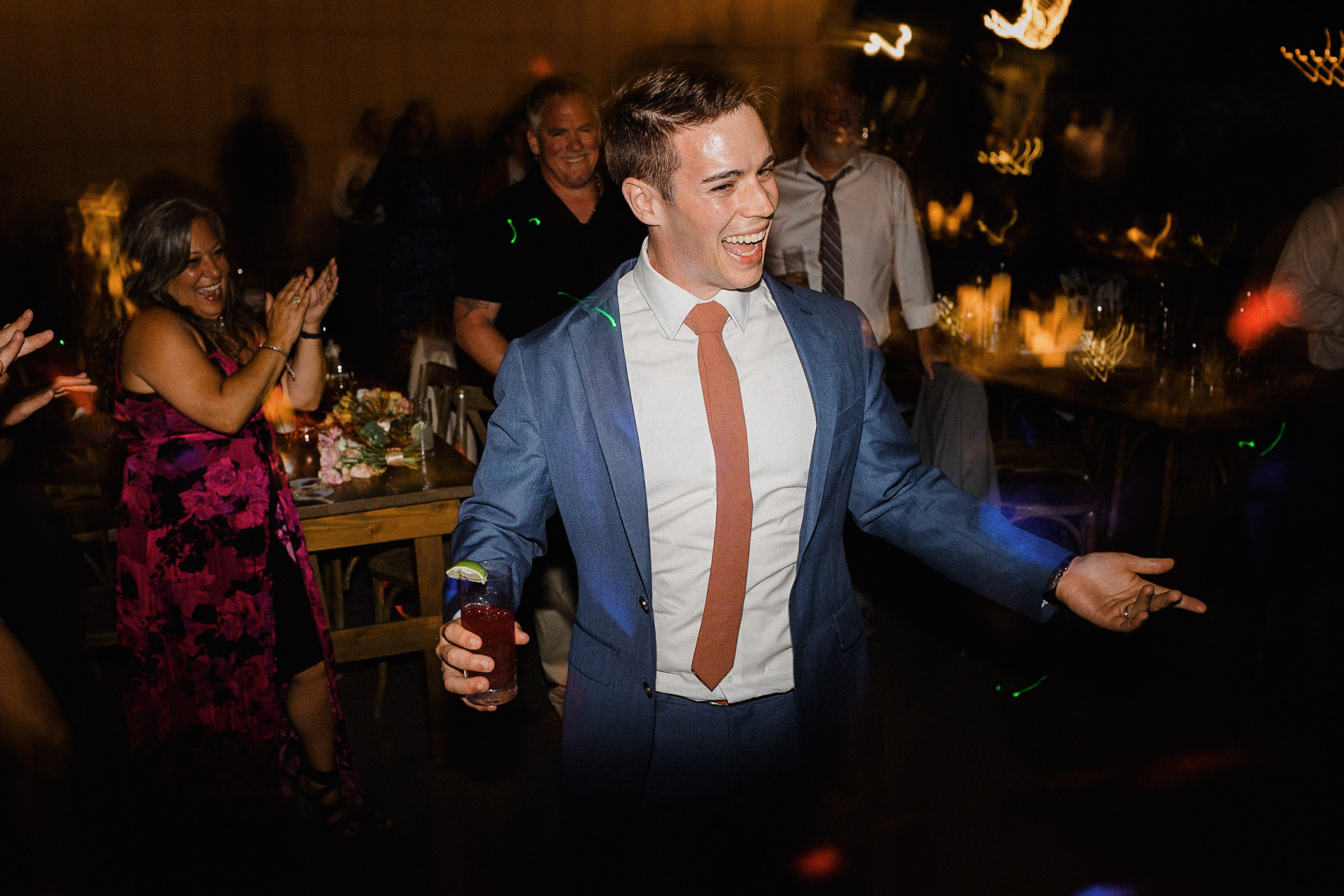 Groom enthusiastically joins the dance floor 