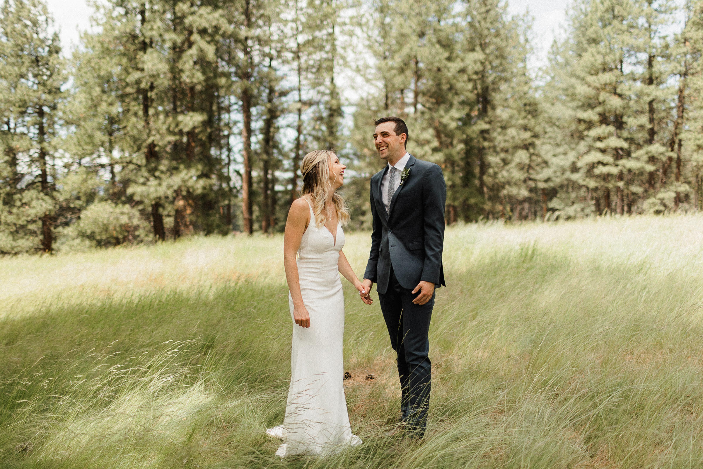 Bride and groom laugh during their first look