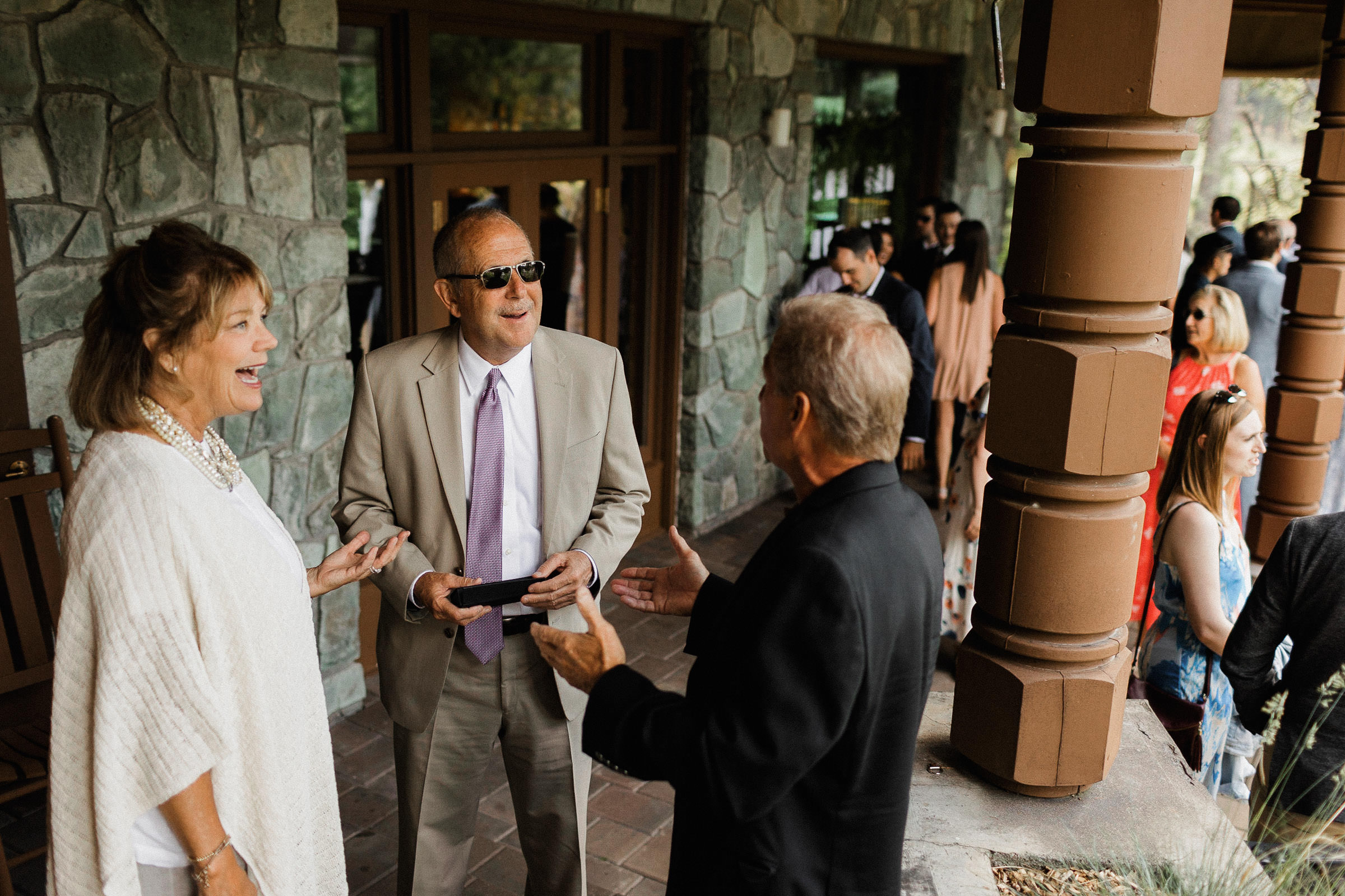 A group of guests chat during cocktail hour