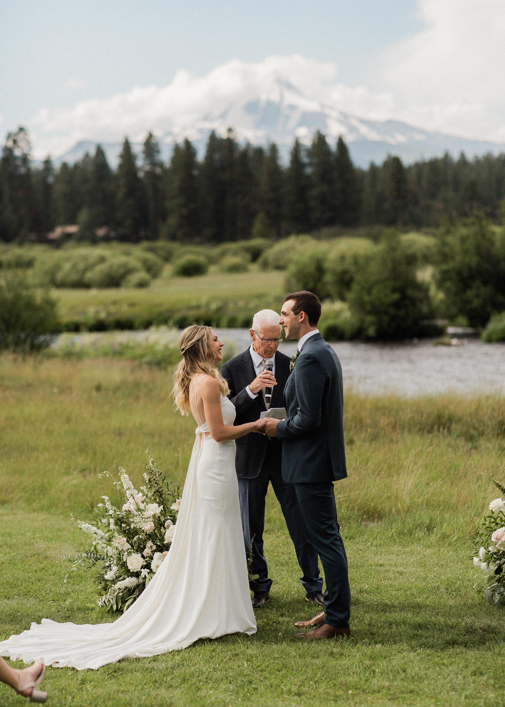 Bride and groom smile during ceremony