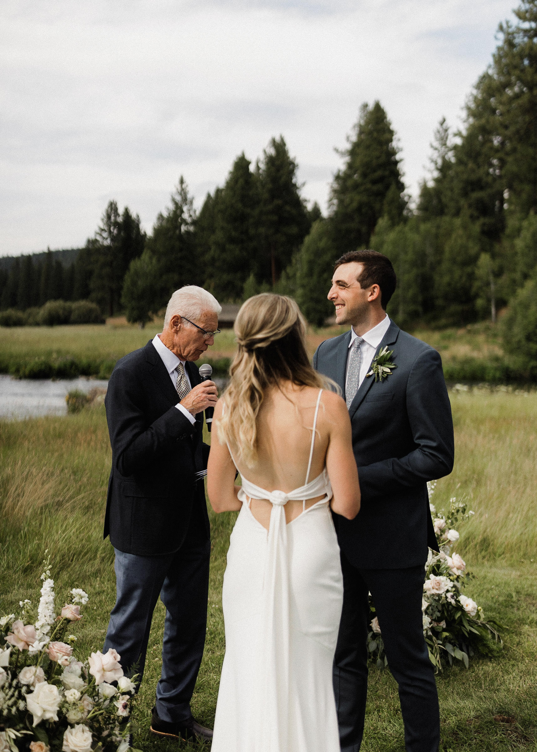 Groom laughs during wedding ceremony